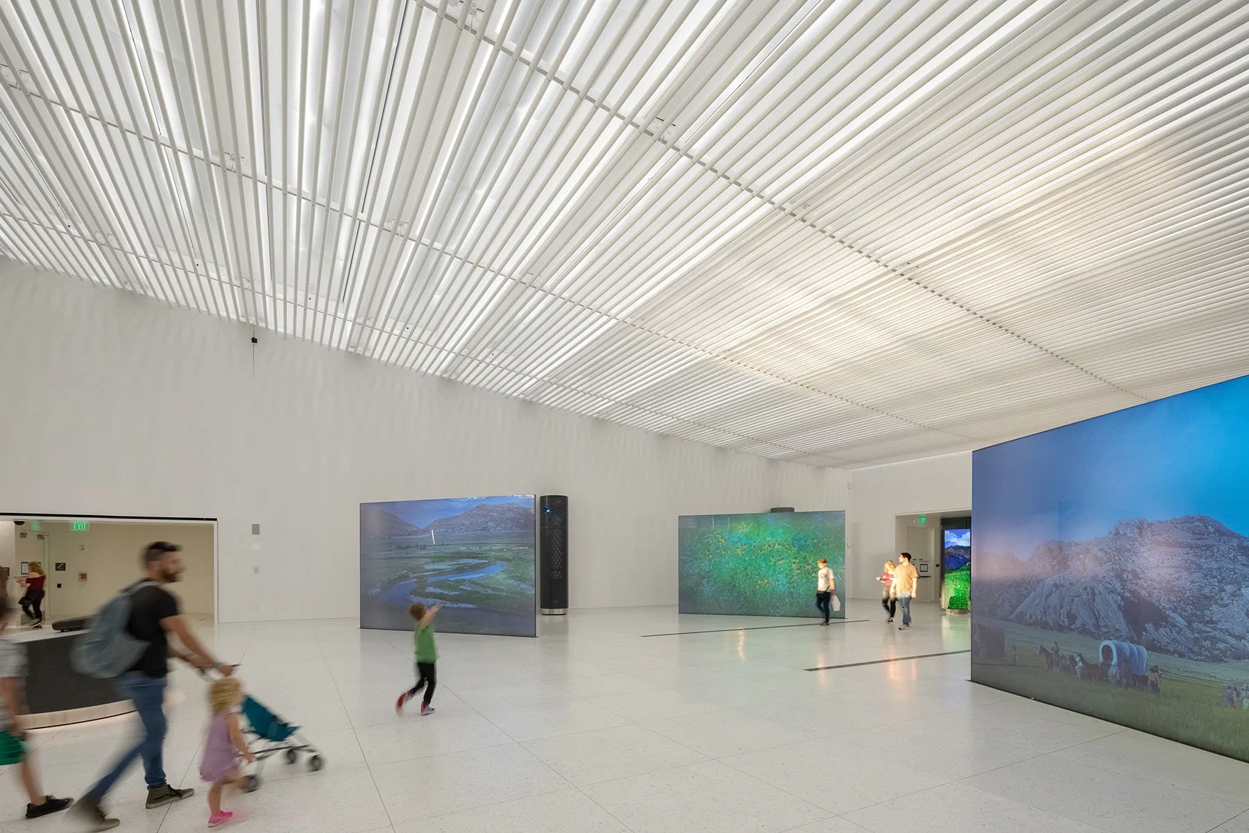museum display of western expansion with illuminated ceiling holding up the landscape