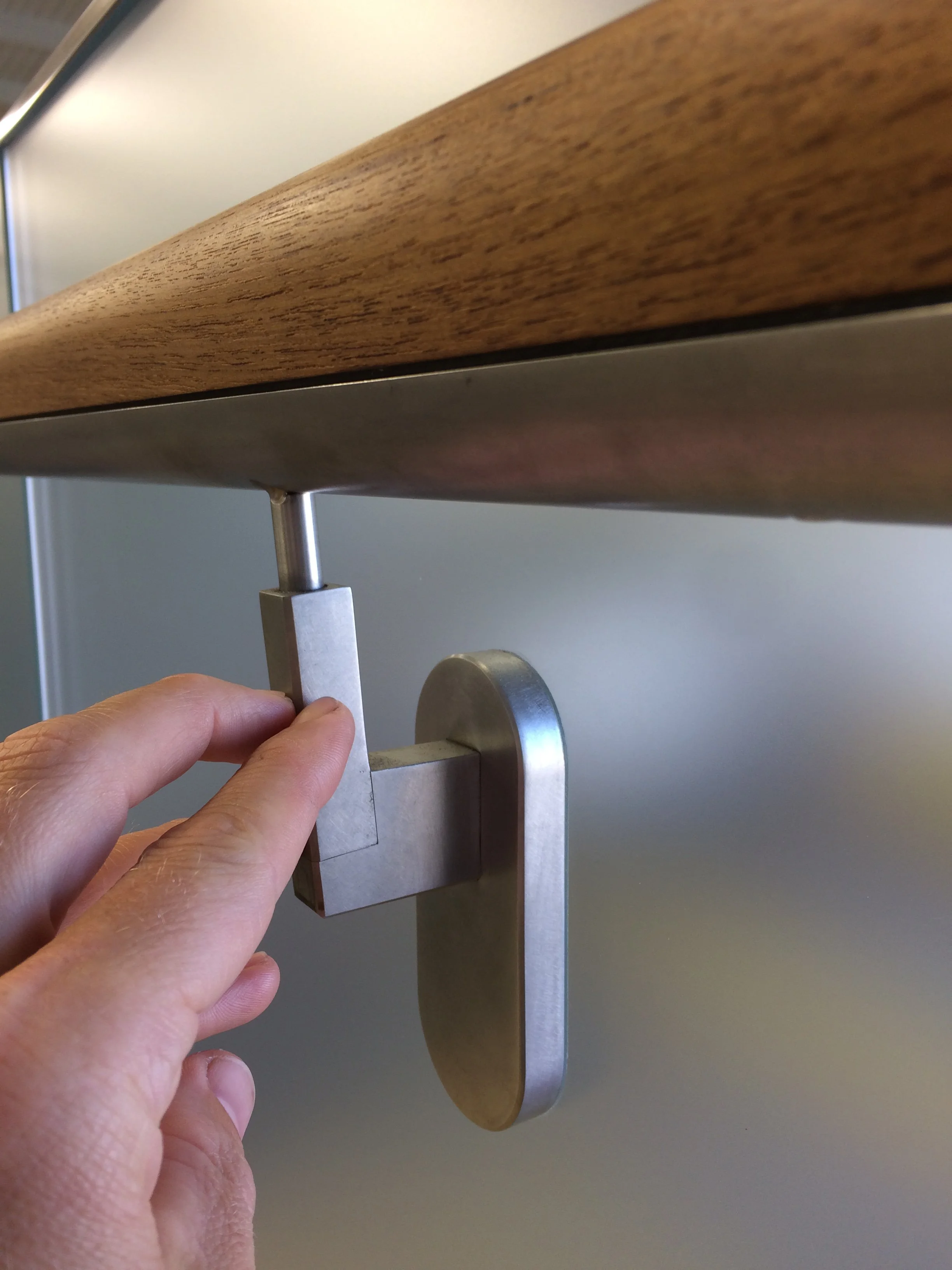attachment of wooden handrail to face of the glass using stainless steel
