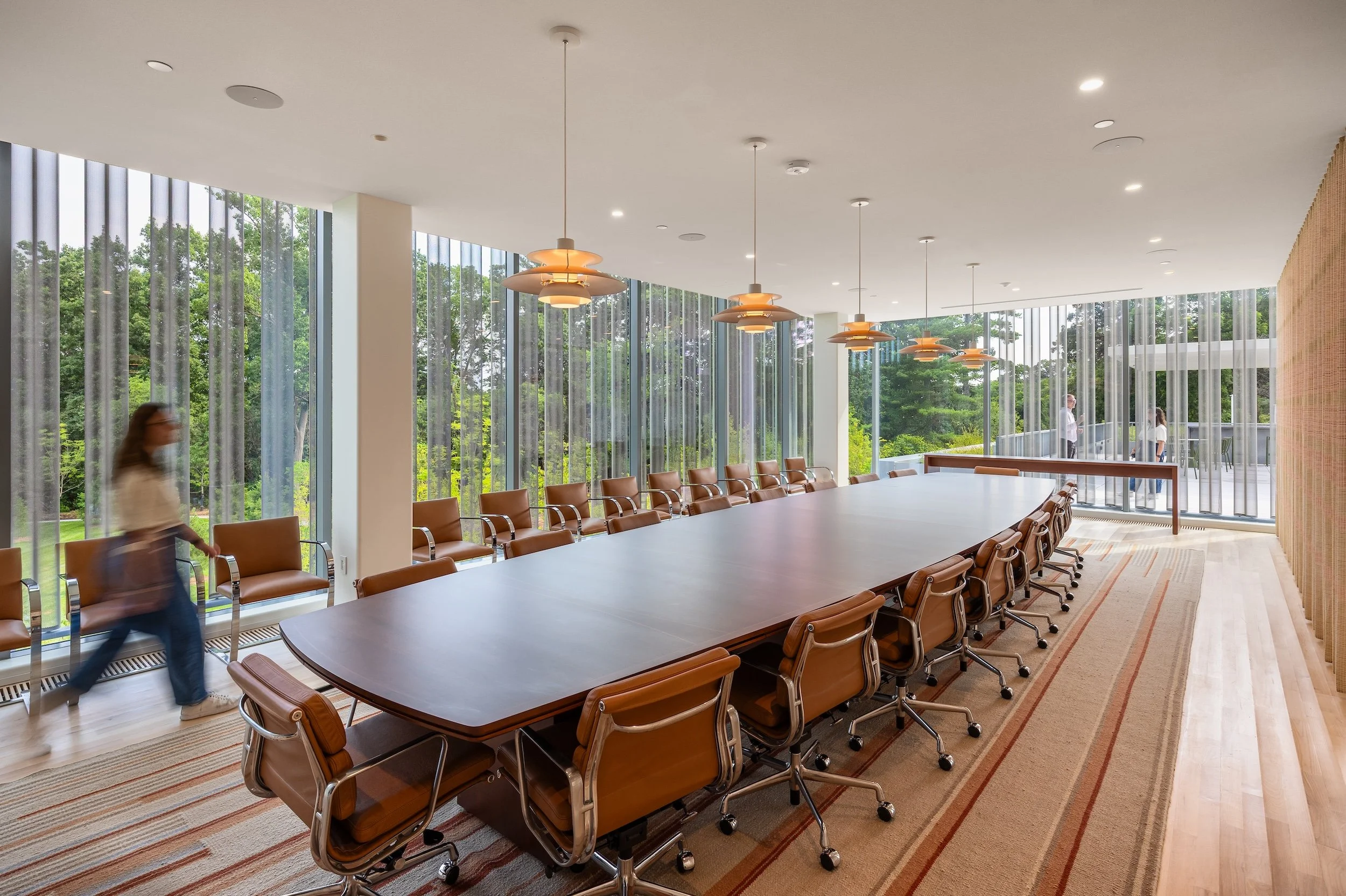 Board room with floor to ceiling windows plus custom table, carpet, and drapery