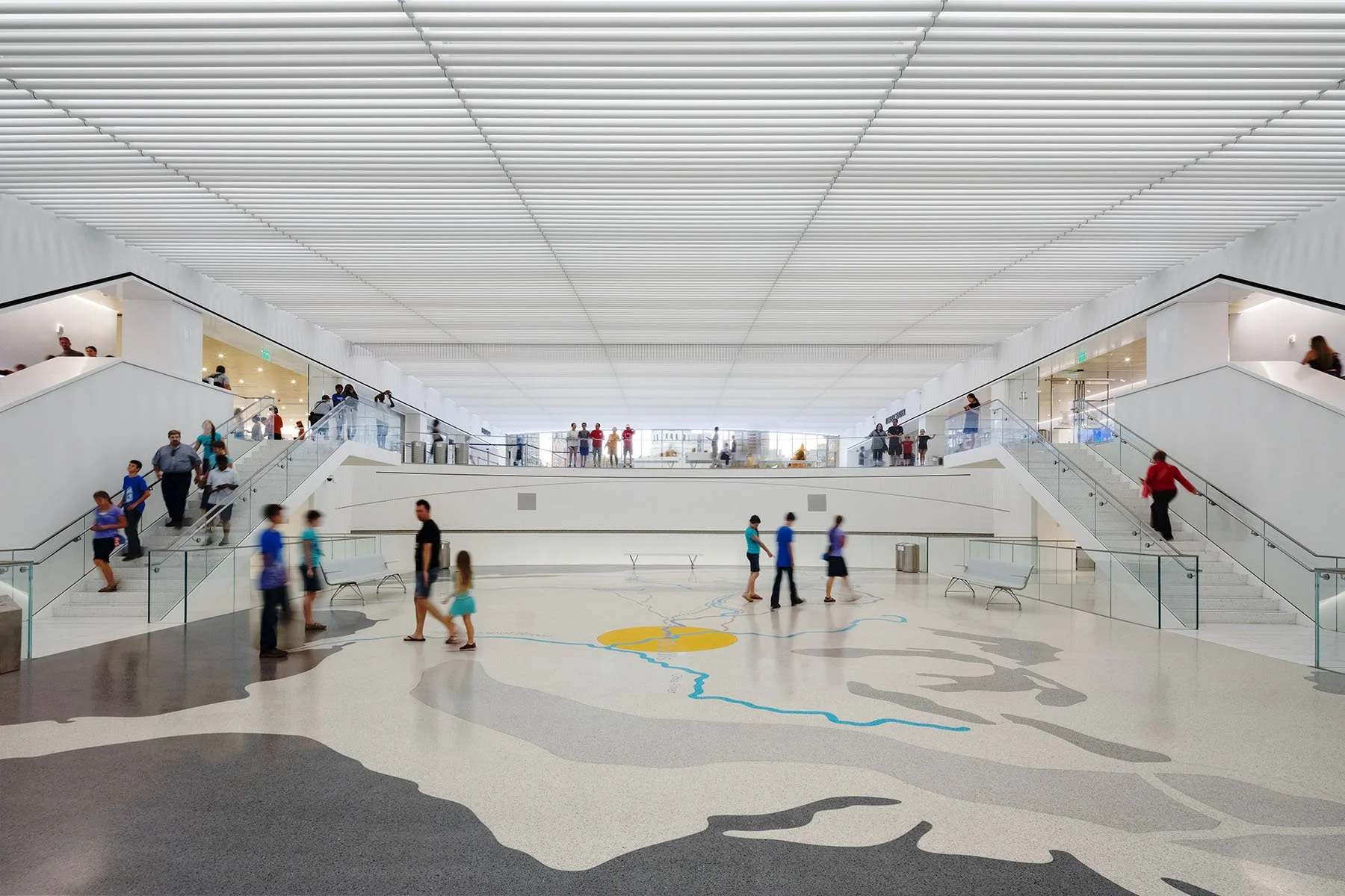 Inside of museum looking out towards courthouse with map illustrated on the floor