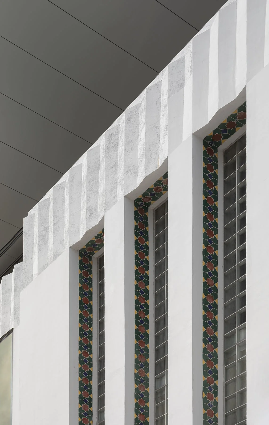 Original concrete and colorful tile facade ©James Ewing