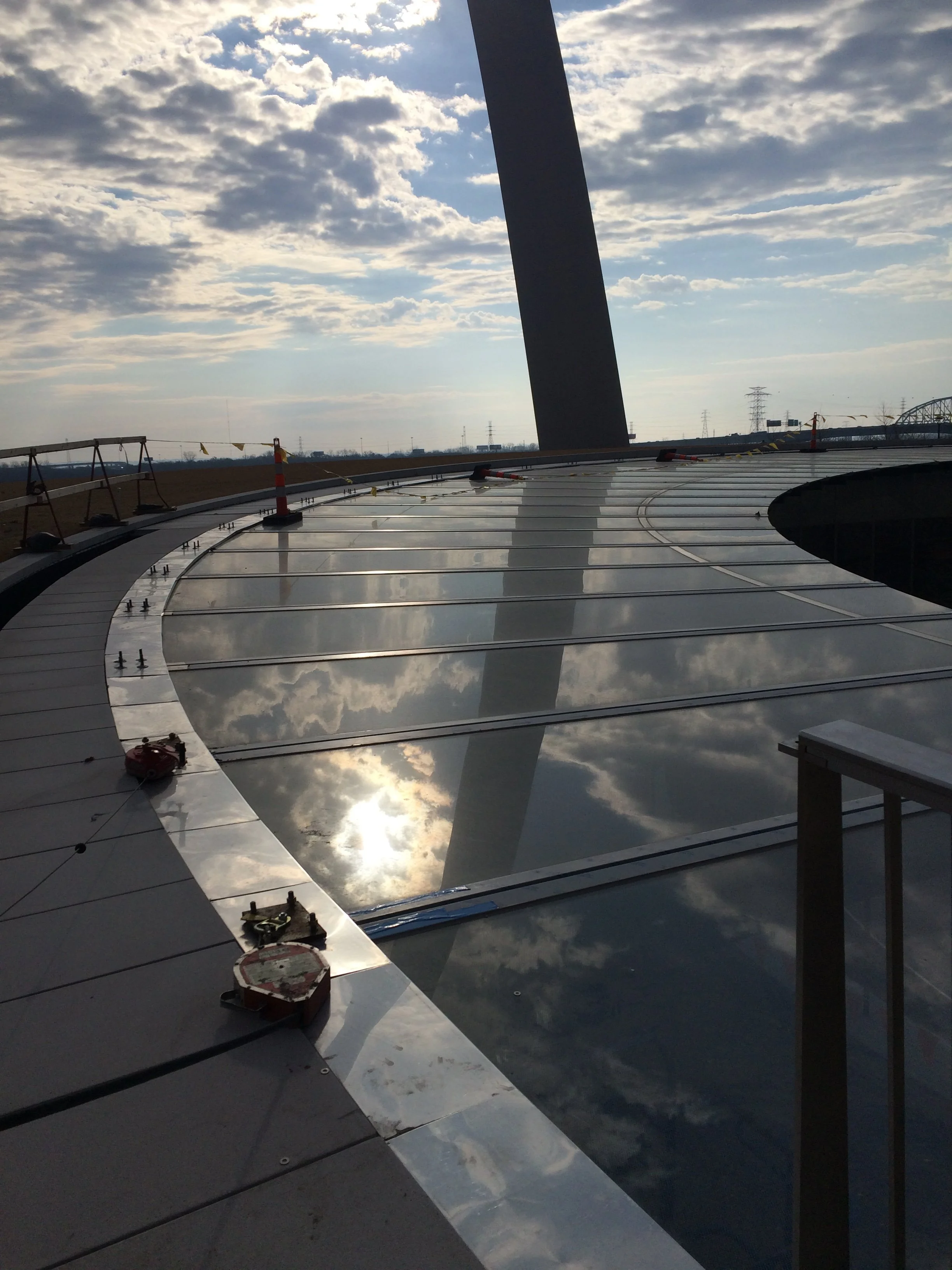 construction progress of glass canopy that reflects the sky