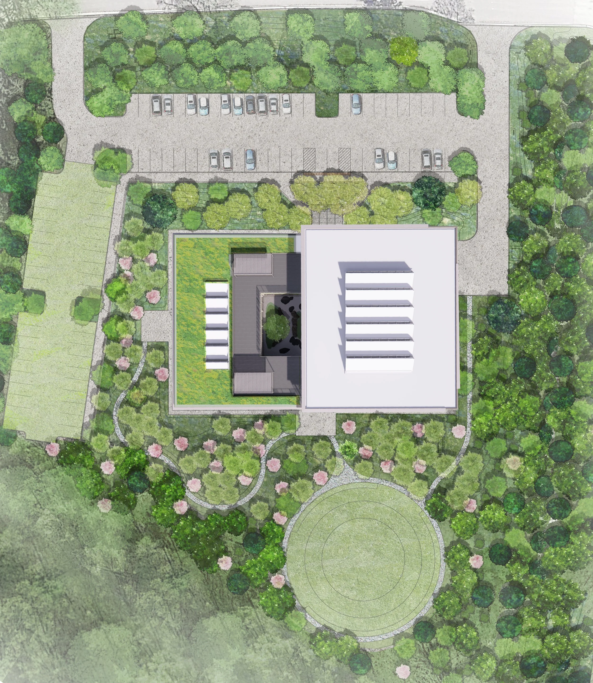Site plan within an established landscape that tucks the building into the existing forest and uses native plants