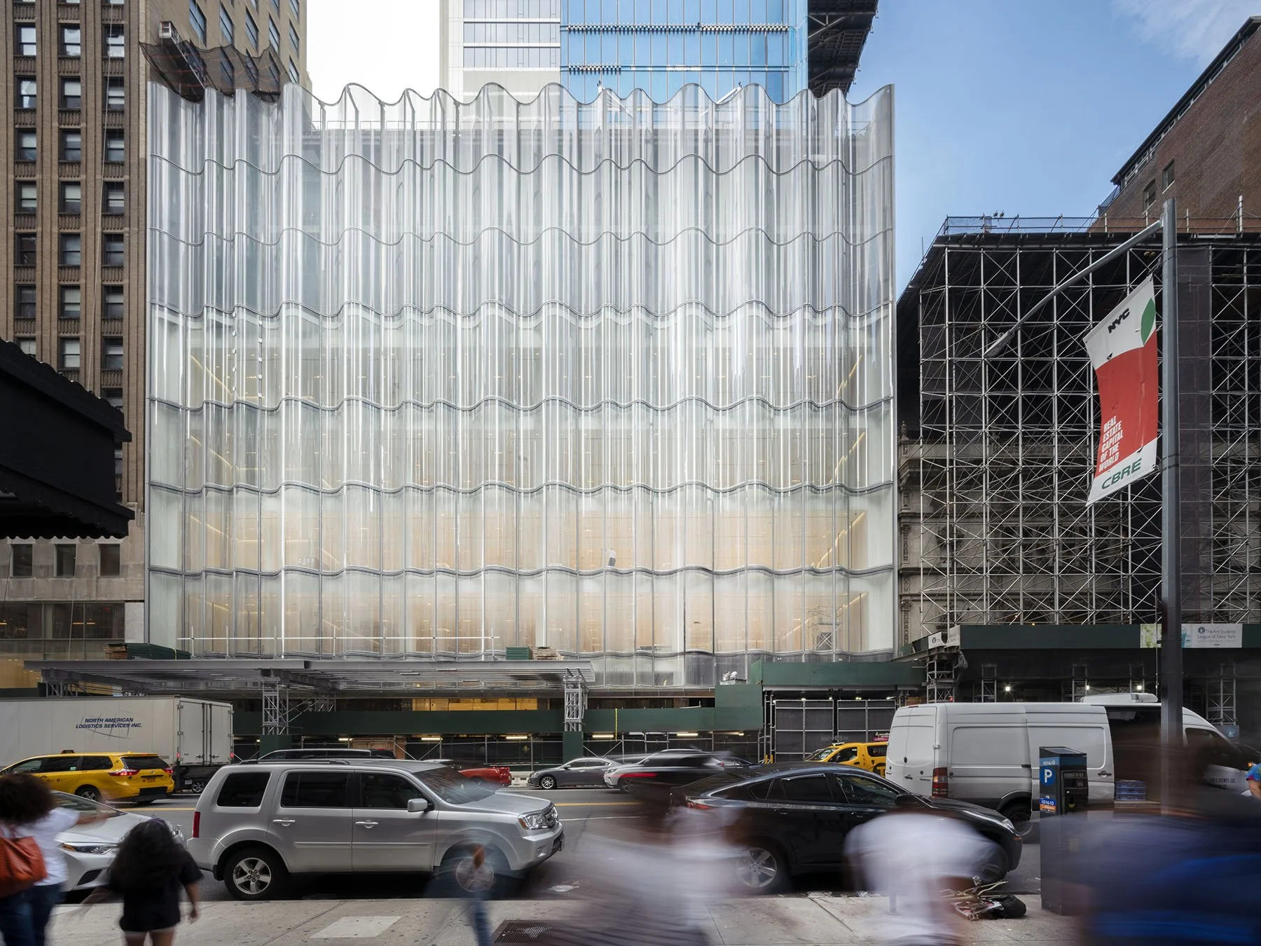 57th street view of nordstrom with wave facade in progress, two buildings on either side are visible