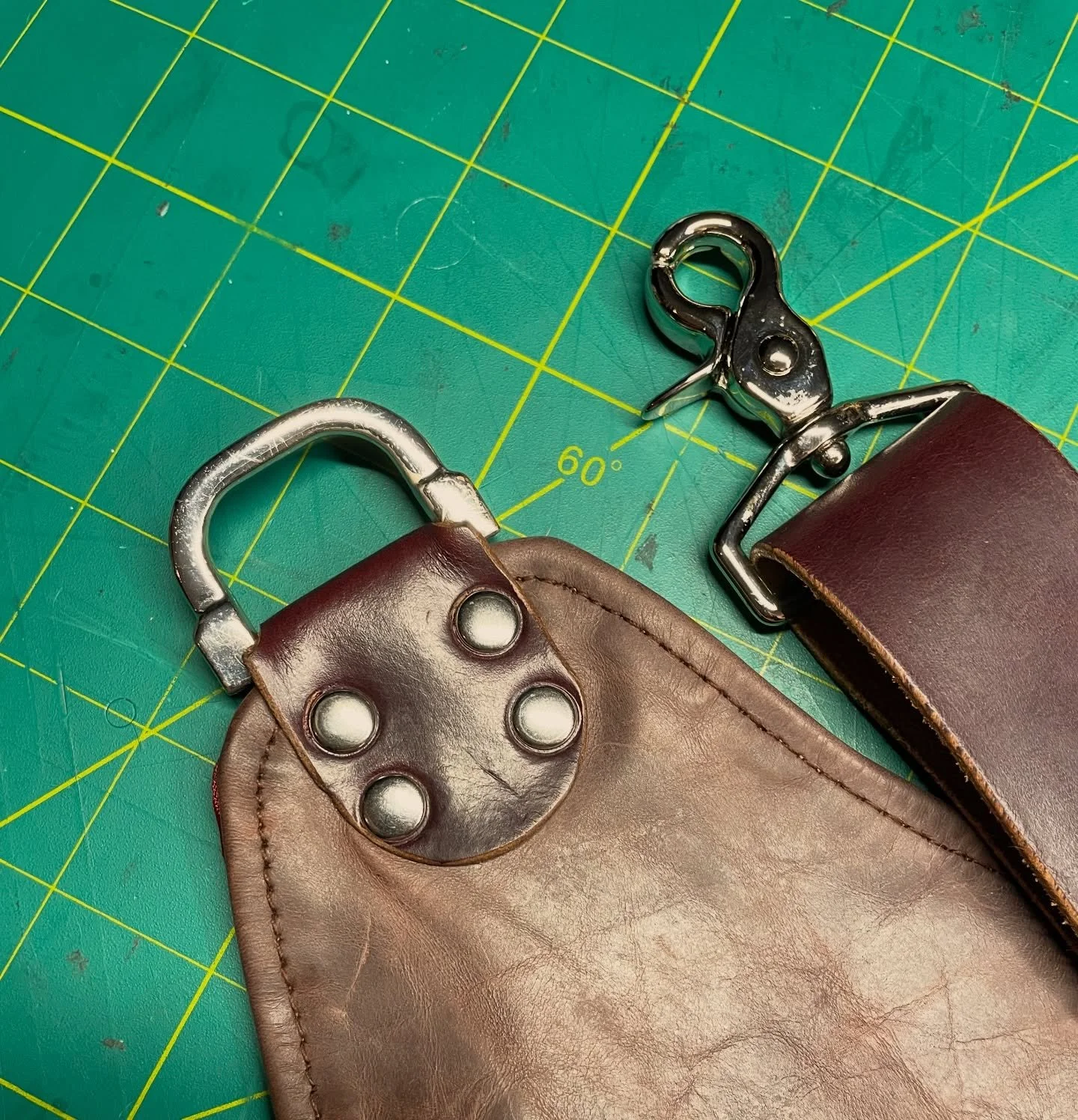 A recent upgrade to a customer&rsquo;s leather apron that he received as a Christmas gift. 

The original strap was cheap and too short for comfortable wear, so I used a combination of new hardware and strap leather, but with a fancy reclaimed D-ring