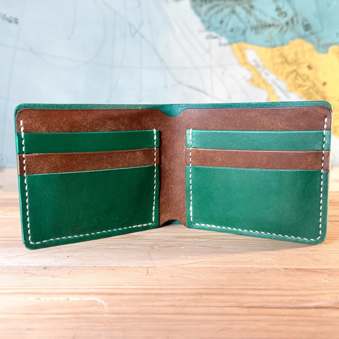 New batch of two-tone bifold wallets going live on the website! Pictured is Green Buttero with Cognac Pueblo interior ($100) 💳💵💲

I&rsquo;m super happy with the way this one came out. I think I&rsquo;m getting the hang of this! 🧐🐄🤠

#leatherwal