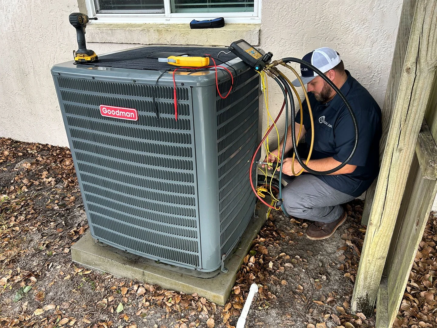 Nordic Air Conditioning repair man fixes AC unit