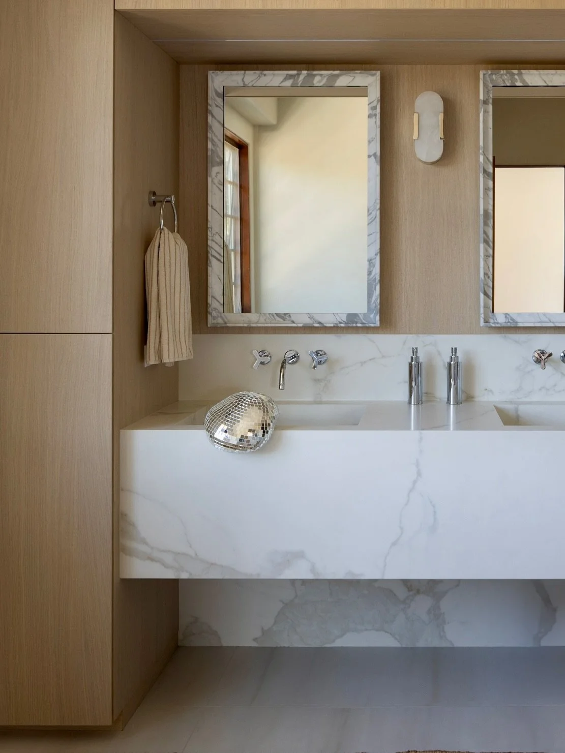 Soft woods, porcelain marble, and a hint of disco 🪩 ✨
Primary bath + closet dreams with @lamarcstudio &mdash; the definition of fresh and chic.

Builder: @jimpapenhausen 
Photo: @naderessaphoto 

#ggtiledesign #lamarcstudio #bathroomgoals #designins