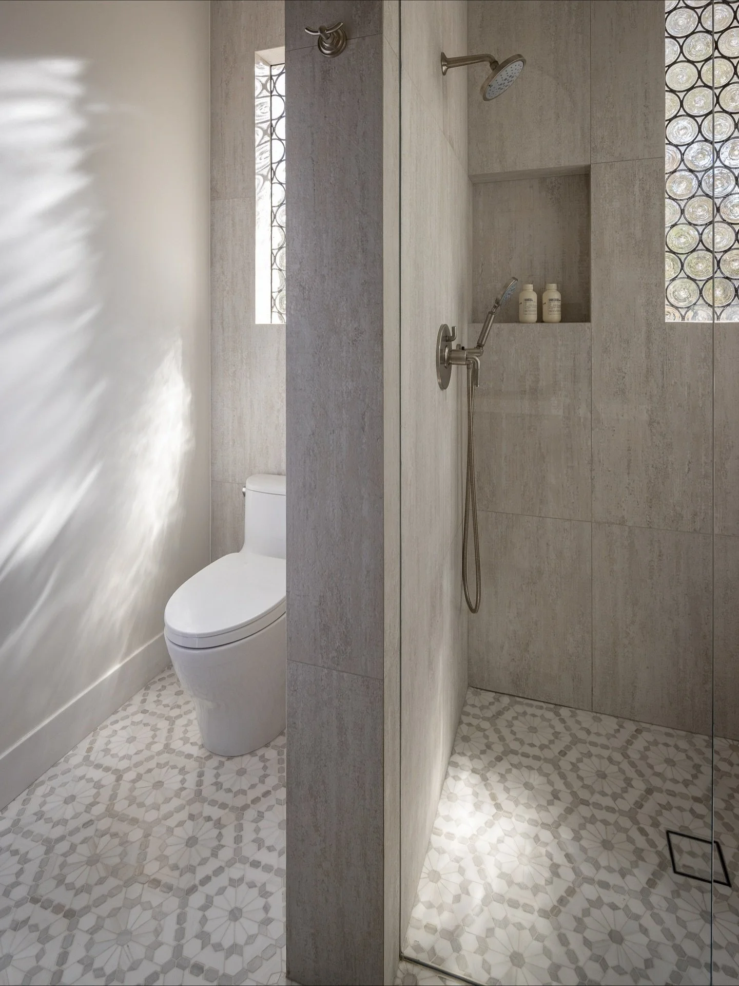 A study in calm contrast &mdash; limestone-look porcelain meets the Enya mosaic floor, balancing organic texture with modern geometry.
Available exclusively through GG Tile &amp; Design for trade members.

Builder: @clintthomson 
Photo: @naderessapho