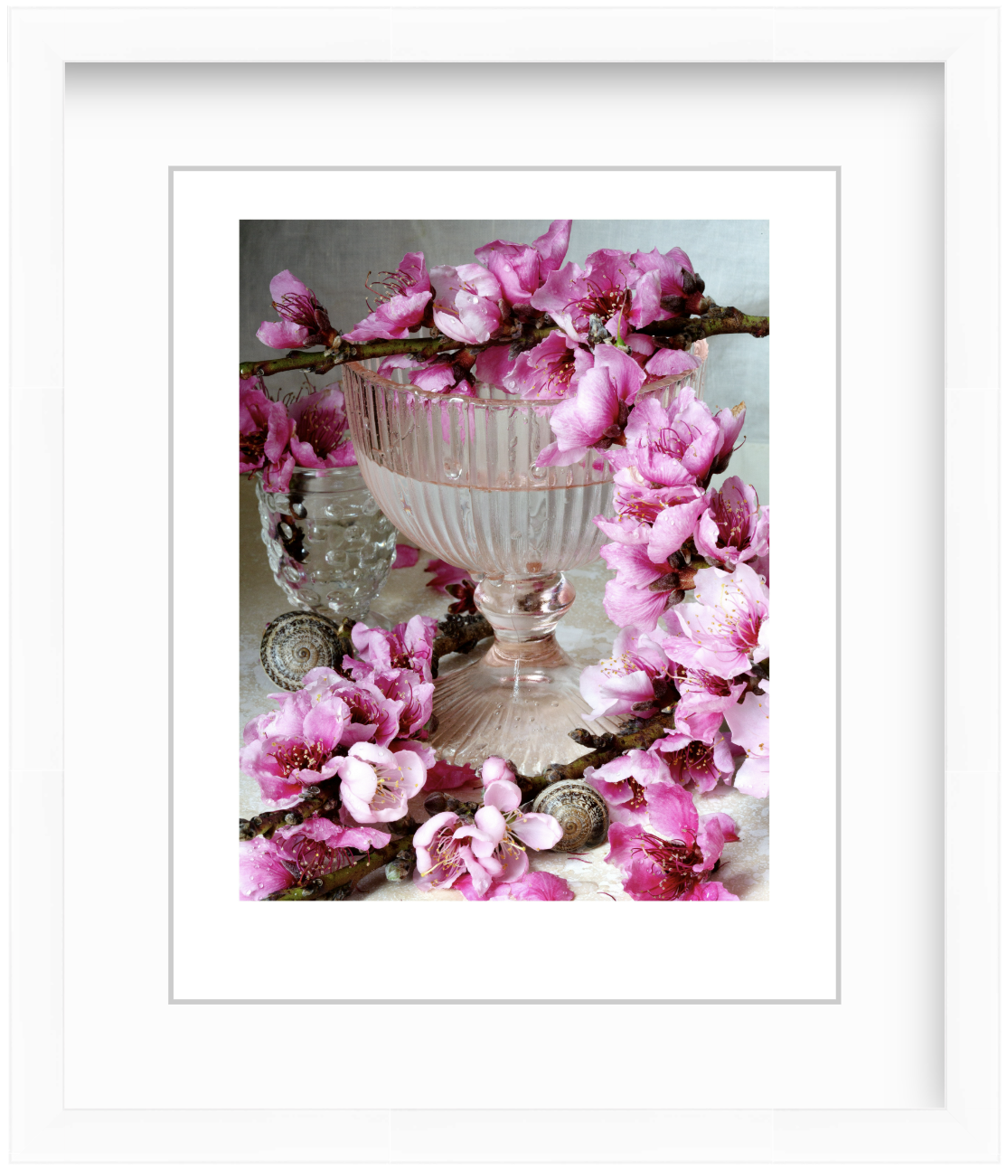 Pink peach blossoms arranged in a modern studio still life with soft lighting and a minimalist fine art composition.