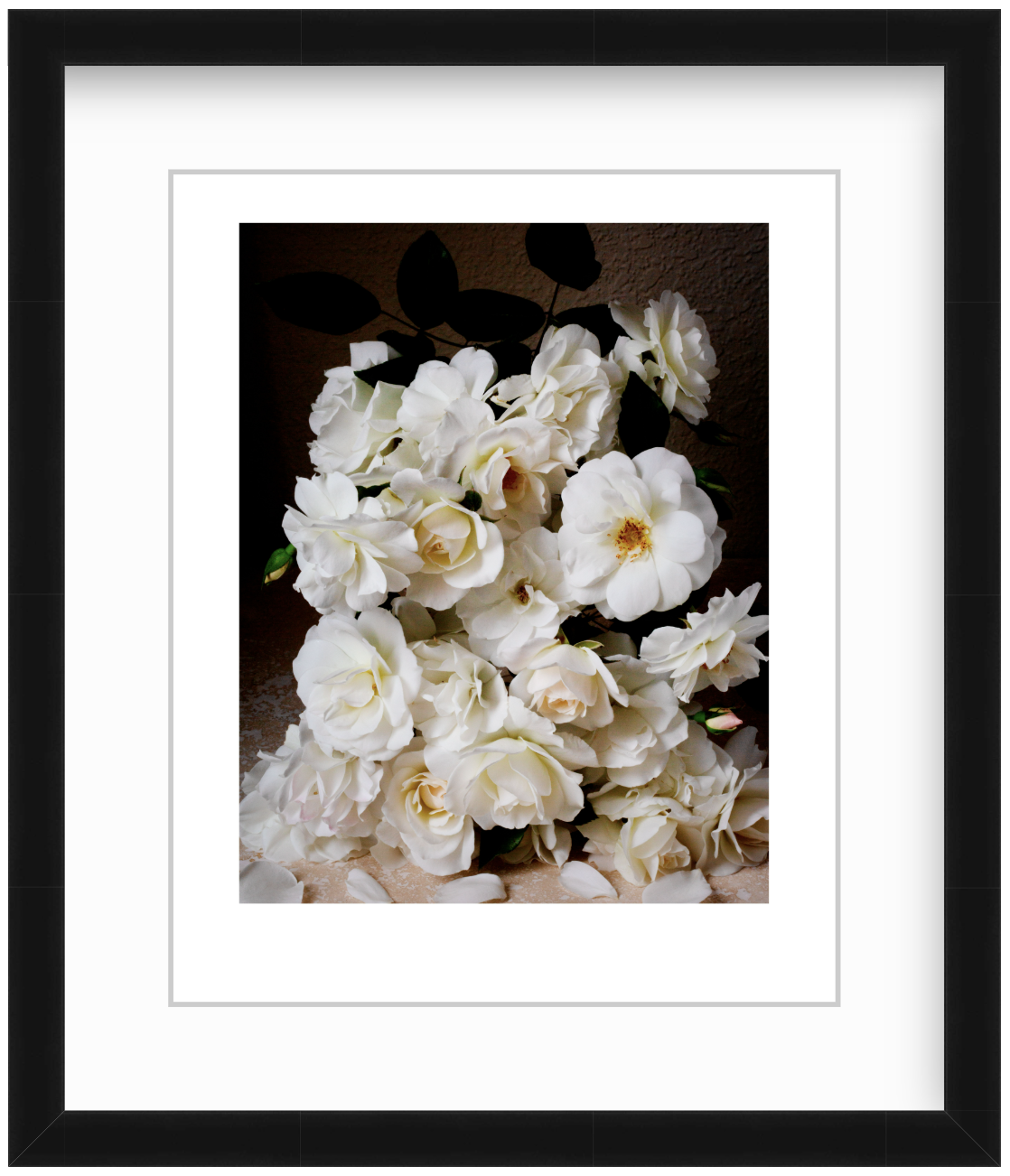 White roses arranged in a studio still life with moody, low-key lighting and a dark background, creating a soft and elegant fine art floral composition.