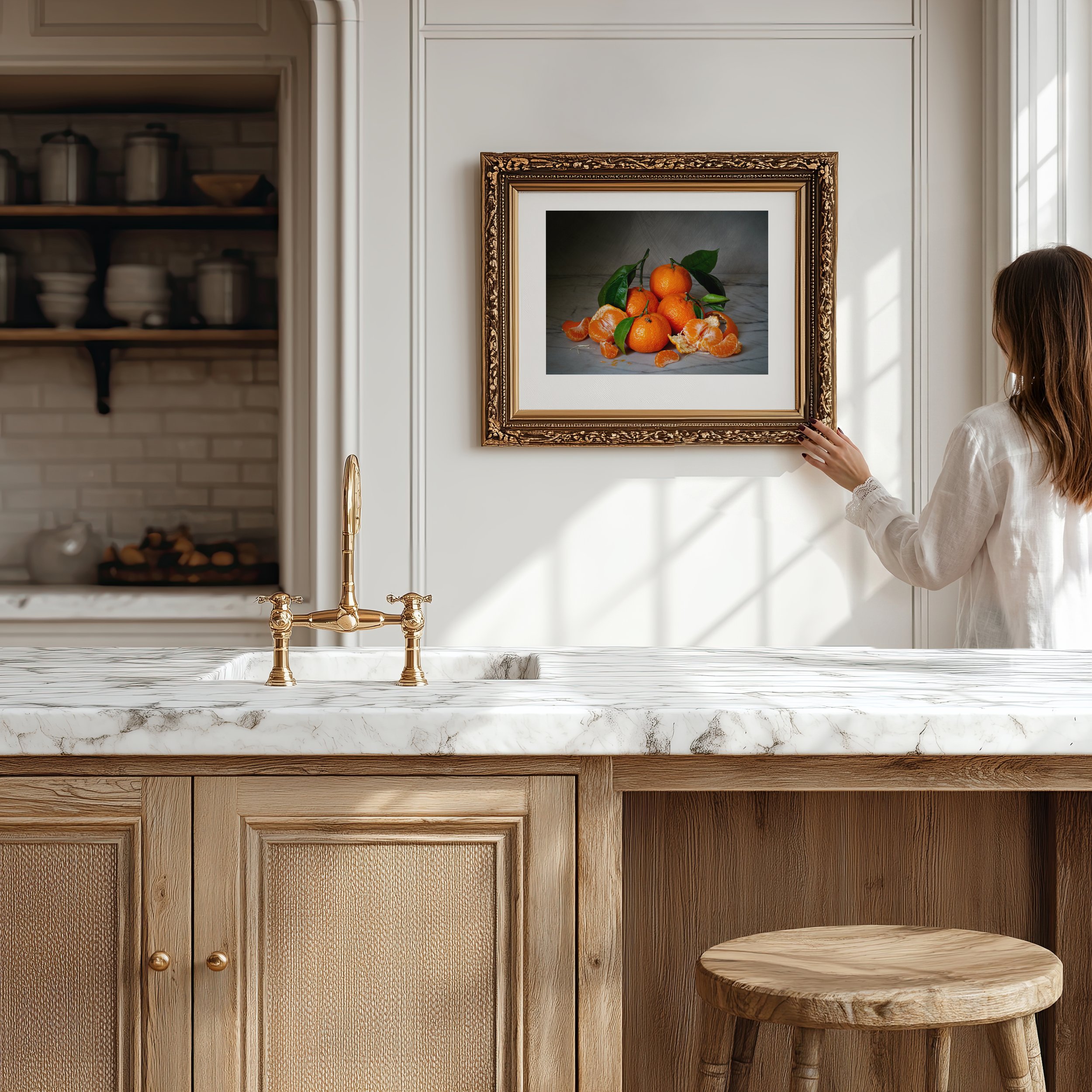 Moody still life photograph of mandarin oranges with a bee in frame on kitchen wall