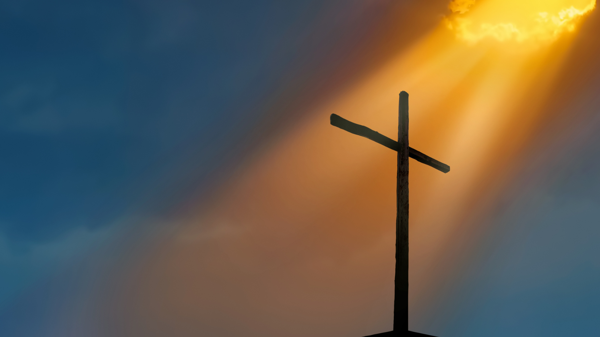 Silhouette of a wooden cross against a dramatic sky with sun rays.