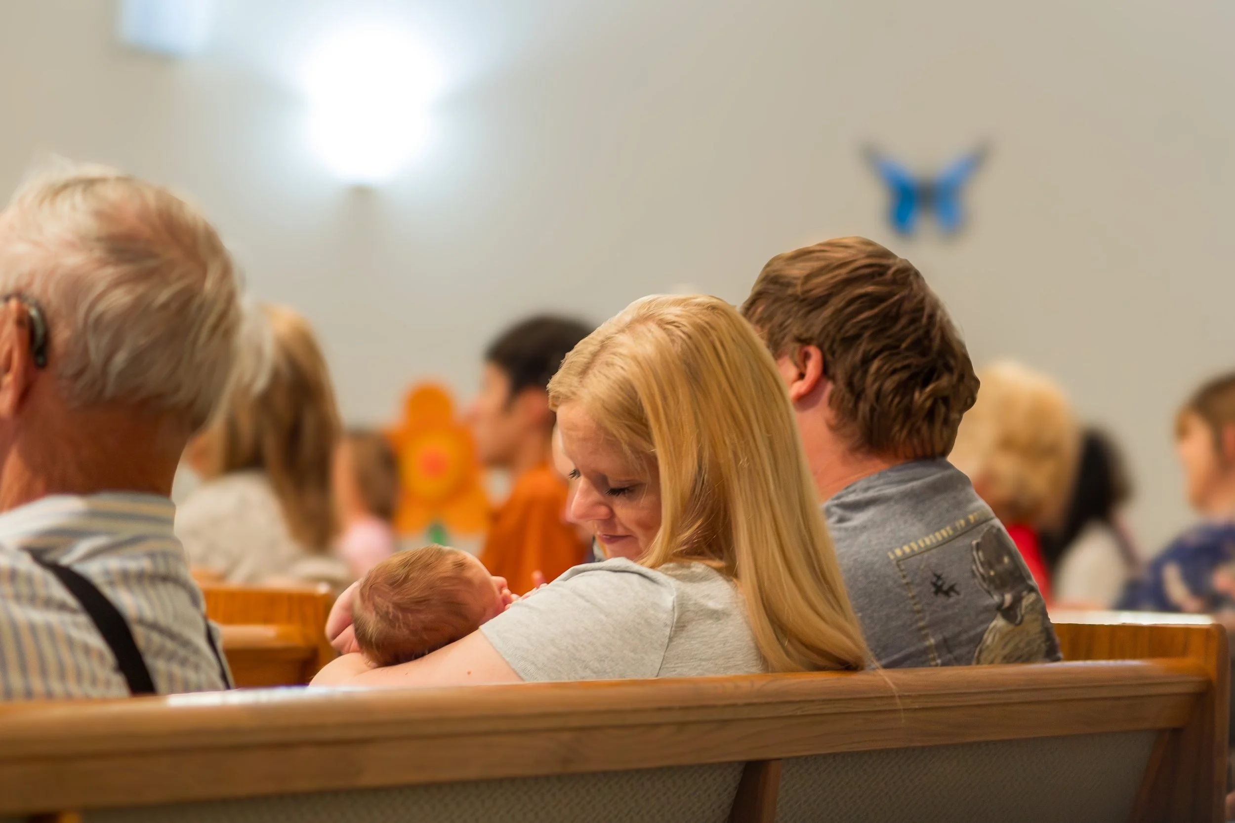 Teacher reading with four young children