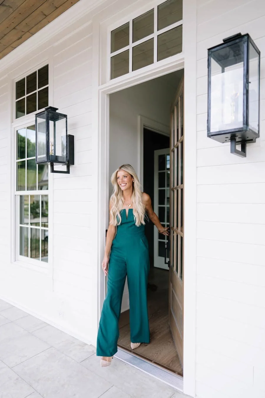 moving to tennessee pros and cons - woman walking out her front door onto a porch