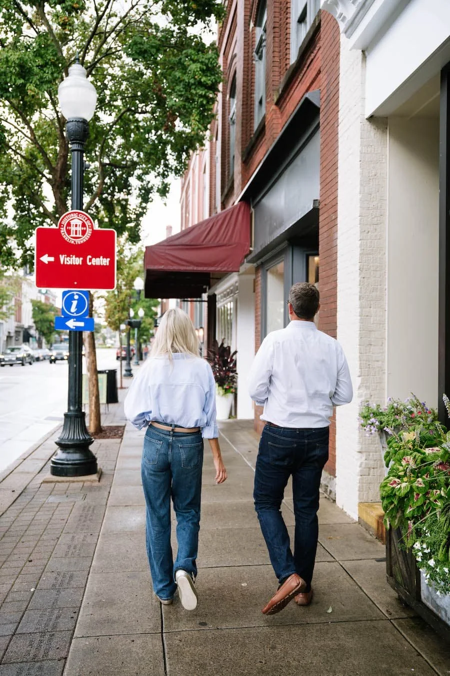 moving to tennessee pros and cons - couple walking down the street in downtown franklin, tn