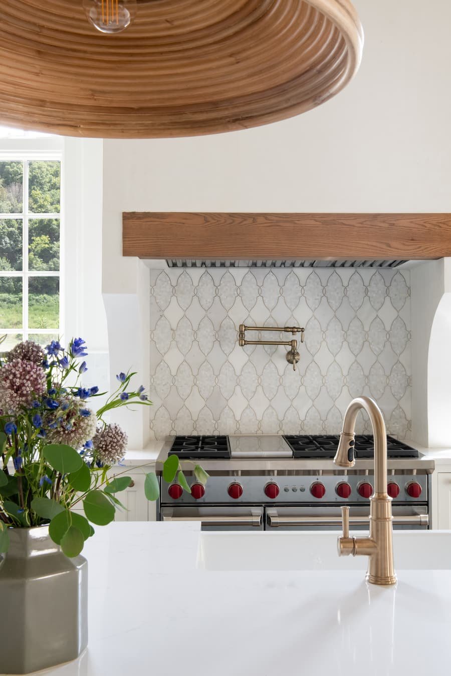 chefs kitchen - photo facing the stove. there's a pot-filler on the wall