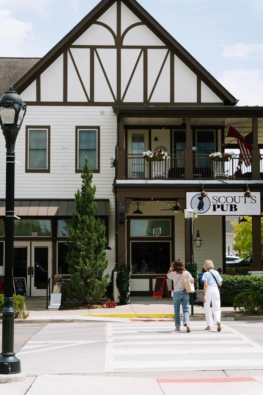 moving to tennessee pros and cons - two women walking across a street in westhaven