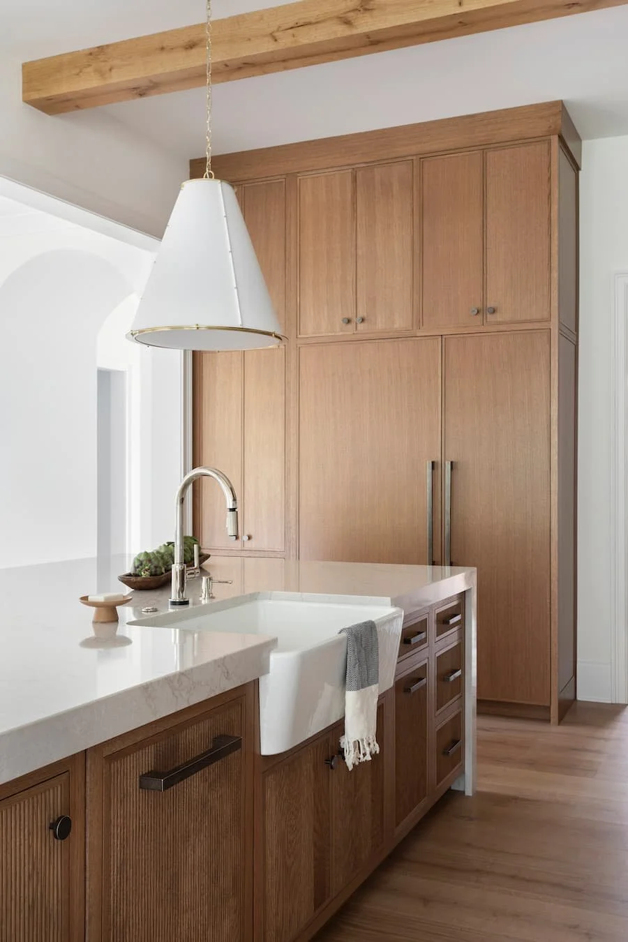 chefs kitchen - photo facing a sink embedded in the island