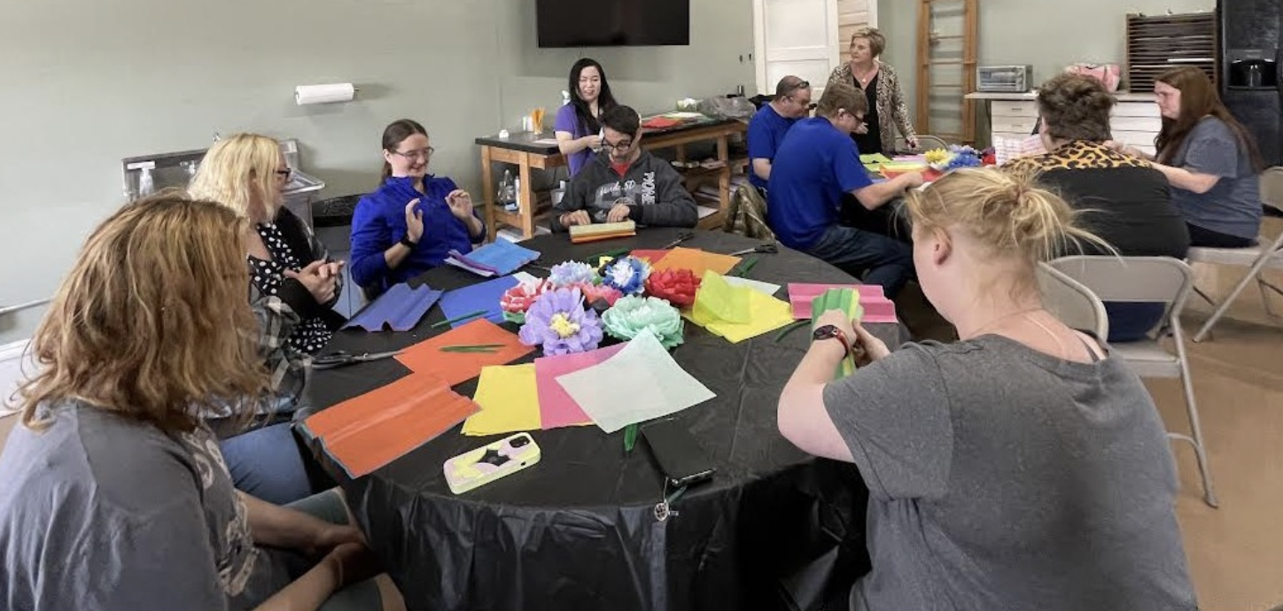 Waseca Arts Council - A group of special needs individuals create tissue paper flowers.png