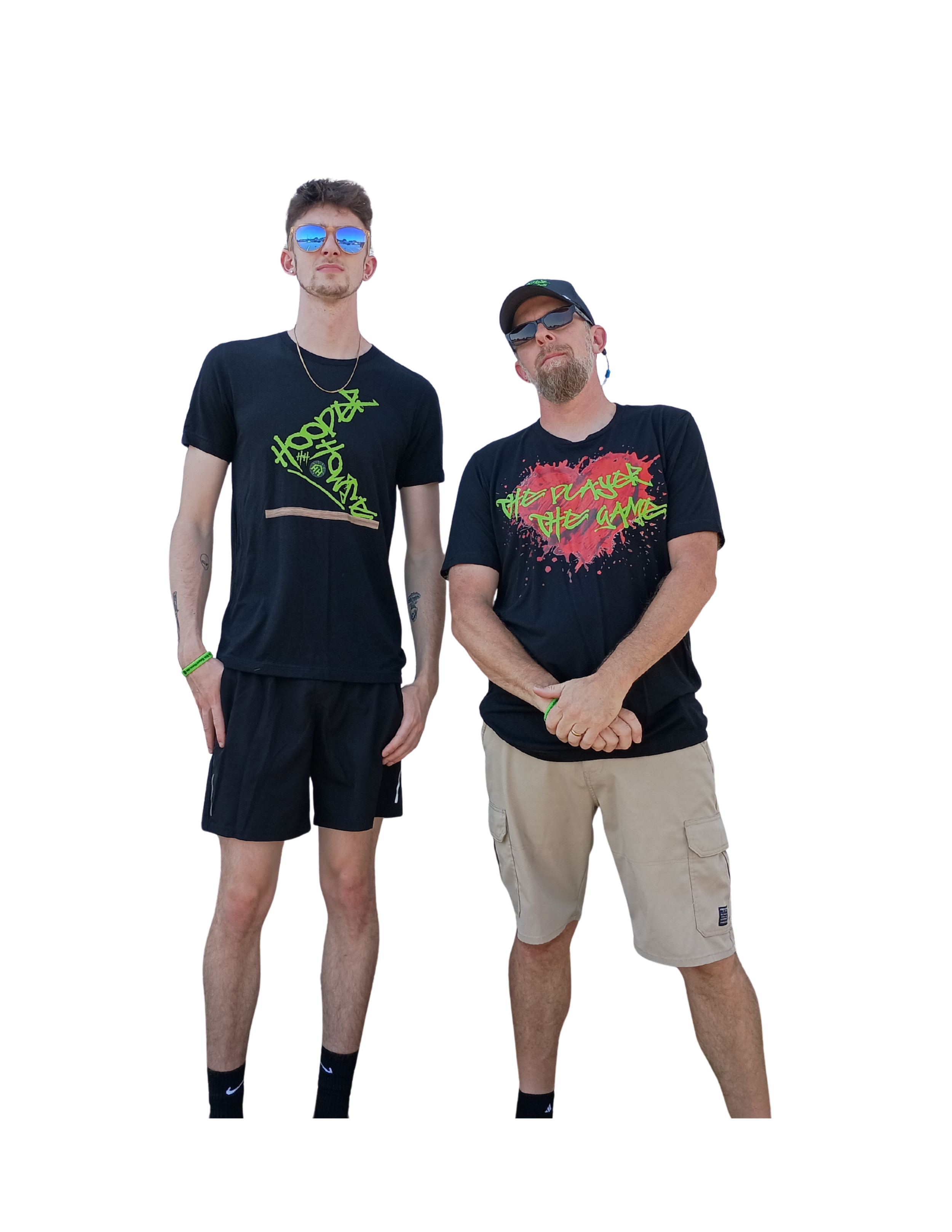 Two men standing side by side, wearing black T-shirts with neon graphics, sunglasses, and shorts, against a black background.