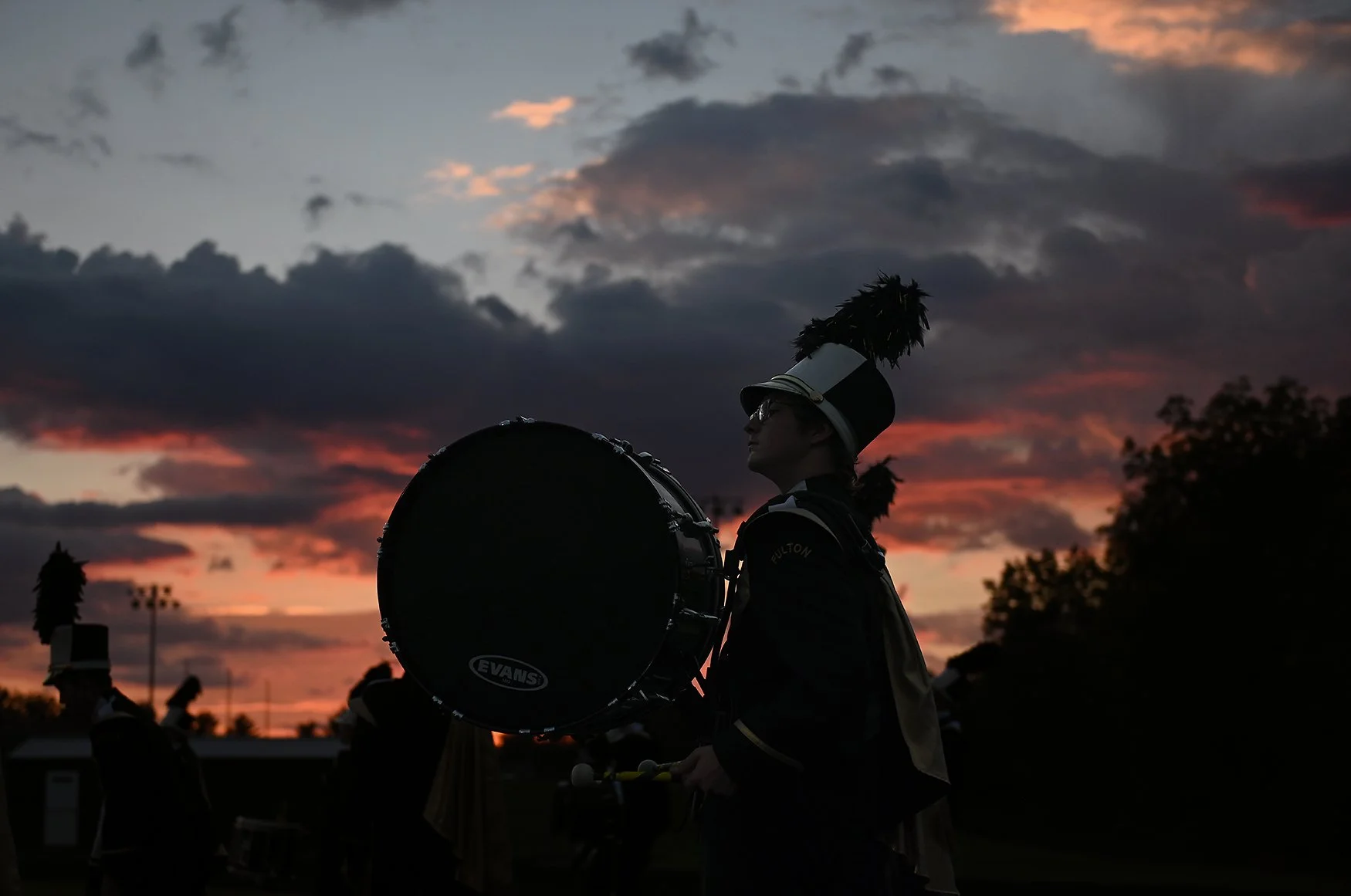 Sophomore Zach Barker waits before walking onto the field on Friday at Fulton High School in Fulton. The marching band performed the Star Spangled Banner with their pregame show before the game. Cooper Evans/Missourian
