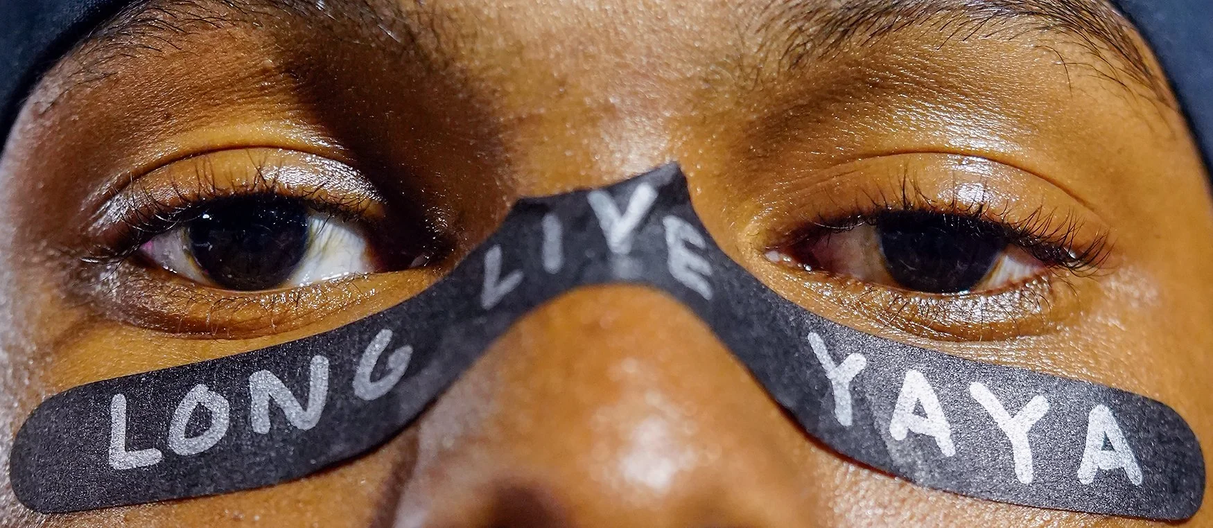 Hickman senior Marcus Johnson wears face tape reading “Long Live Yaya” at a game against Rock Bridge on Oct. 17 at Hickman High School in Columbia. Johnson paid tribute to Stephens College student Aiyanna Williams, who was killed last month in a shoo