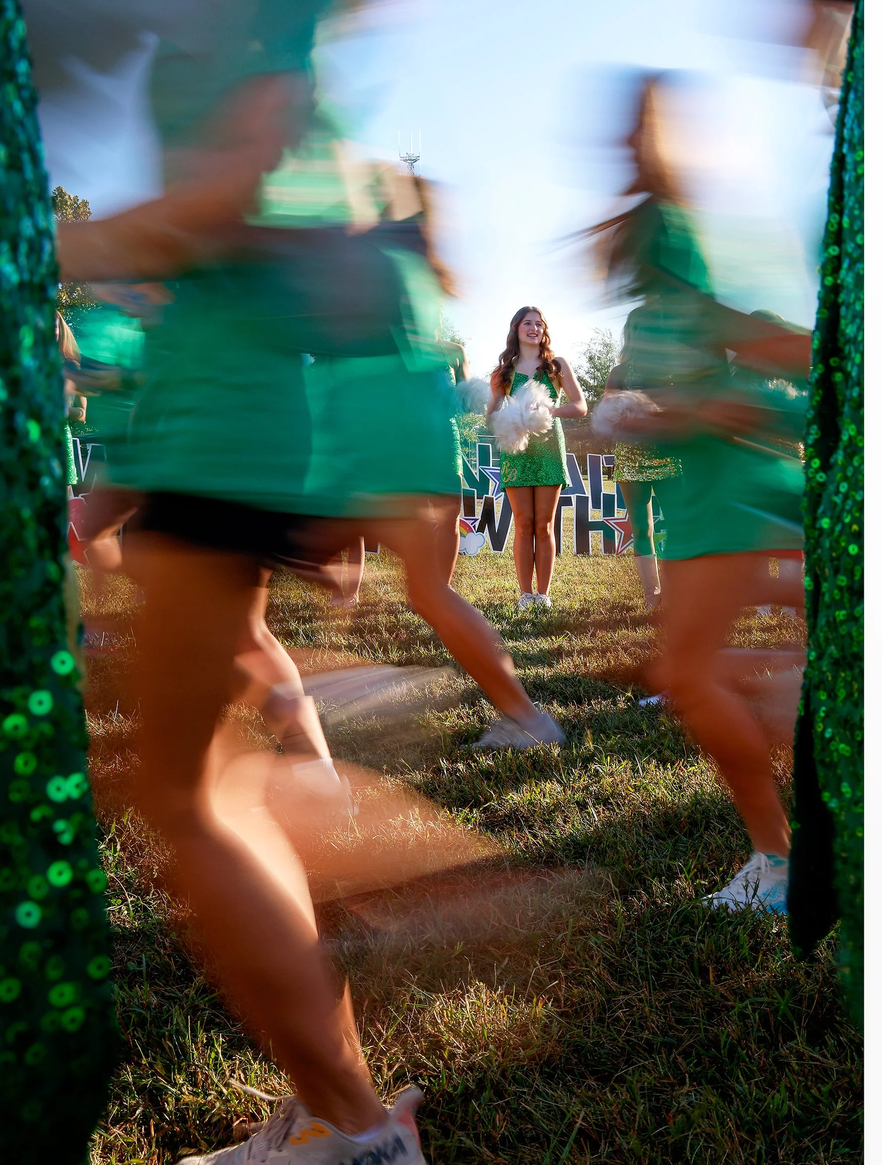 Rock Bridge Bruin Girl Tessa Jenks cheers on runners during Lizzy’s Walk of Faith on Saturday at Bethel Park. The Bruin Girls were joined by the Mizzou Golden Girls and the Mizzou cheer team. Claire Nguyen/Missourian