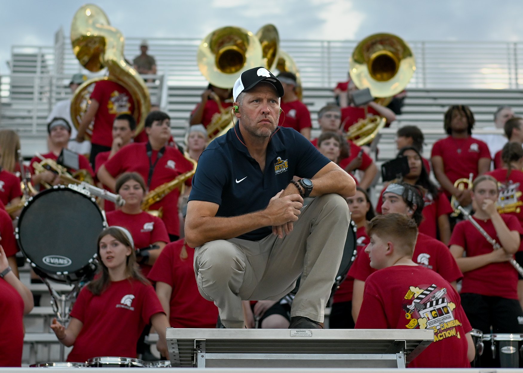 Battle band director Marc Lewis, center, watches the game Sept. 12 at Battle High School in Columbia. Lewis is one of three band directors at the school. Battle fell to Helias 66-6 in a Central Missouri Activities Conference clash. Cooper Evans/Misso