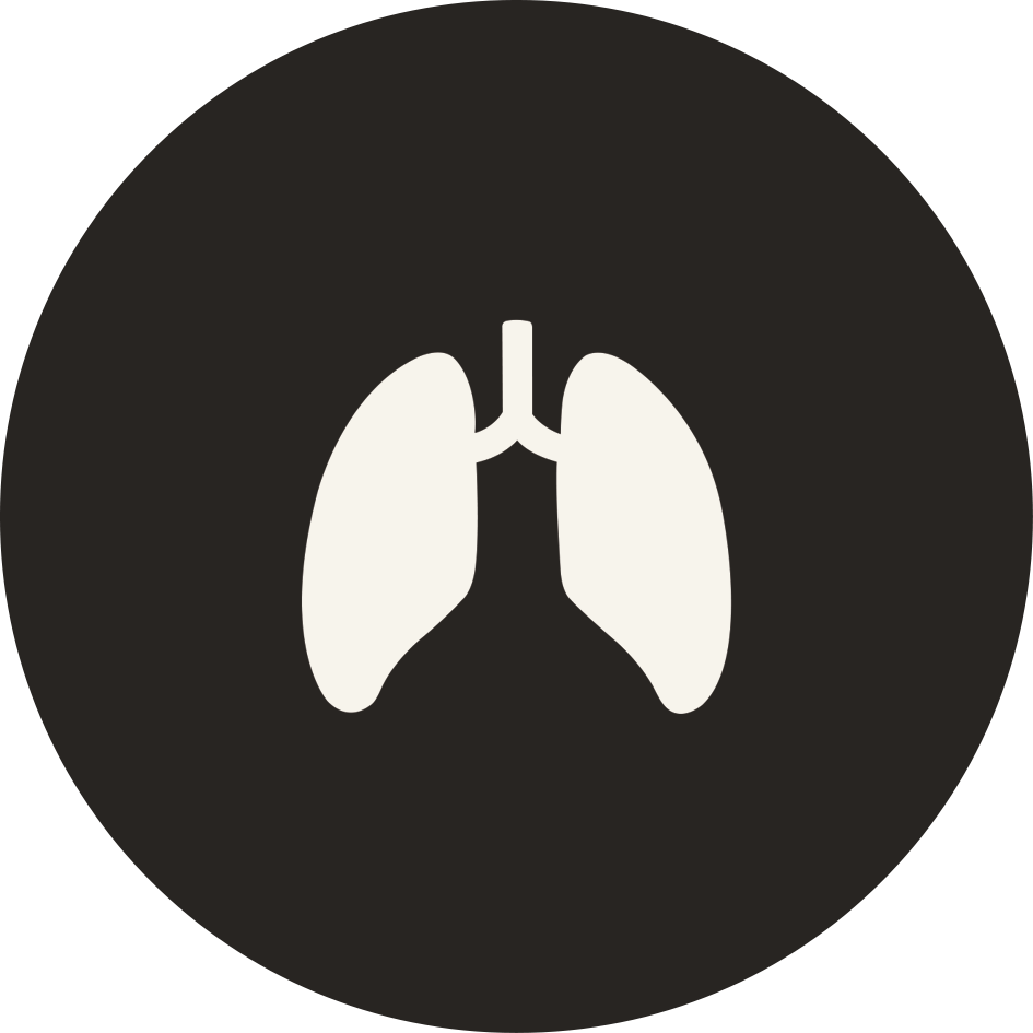 A black circular icon with a white symbol representing human lungs and oxygen therapy support for residents. Offering 24-hour senior care and assisted living in the heart of Puyallup, Washington..