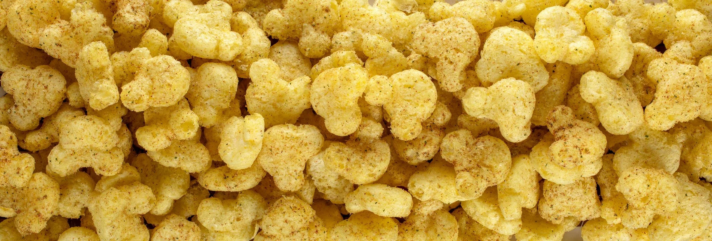 Close-up of seasoned crispy fried chicken nuggets.