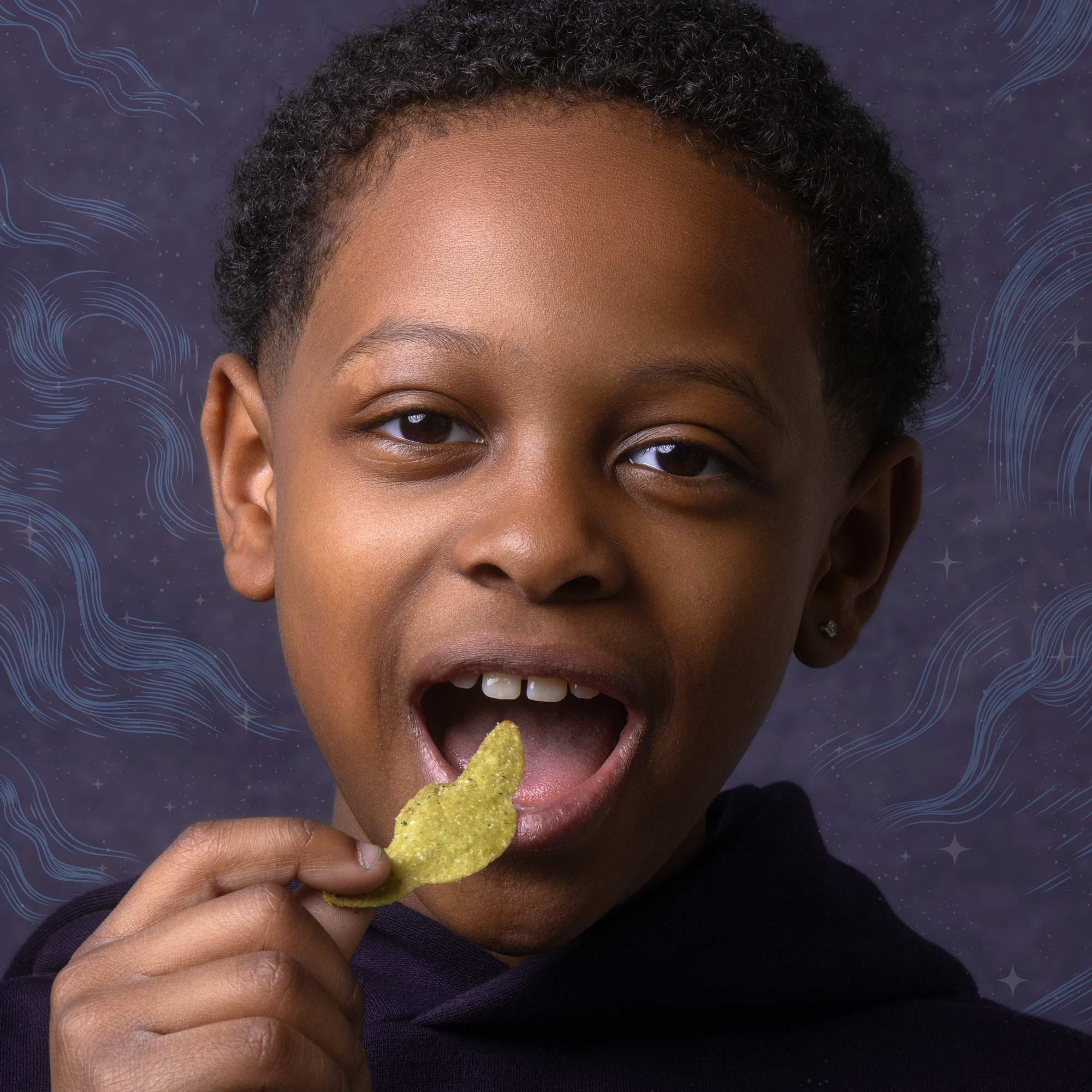 A person with short curly hair and brown skin is holding a yellow potato chip near their open mouth, about to eat it. The background is decorated with a dark space theme featuring swirling blue lines and stars.