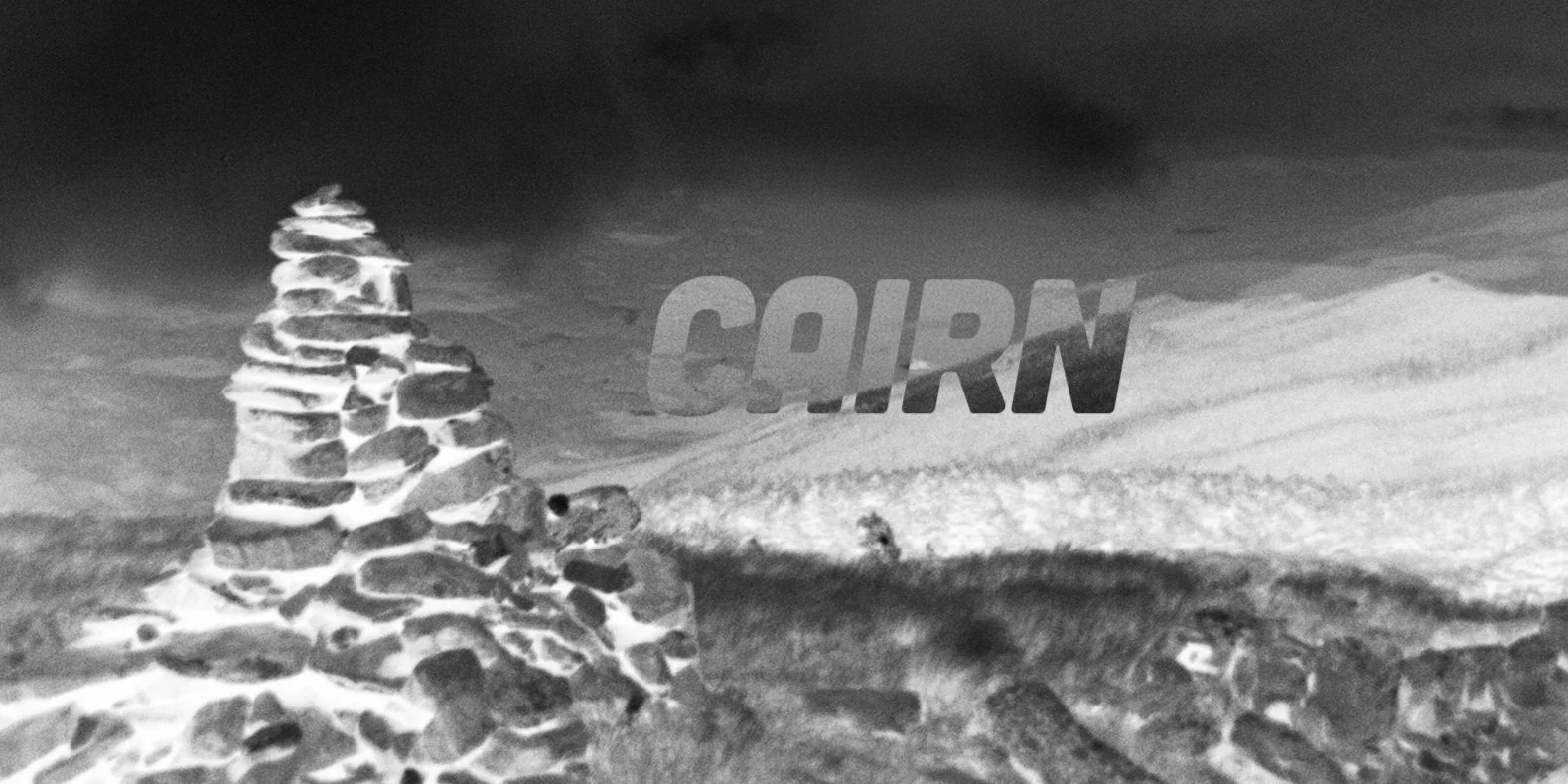 Black and white illustration of a corn stalk and a field with the word "CORN" in large, bold letters across the sky.