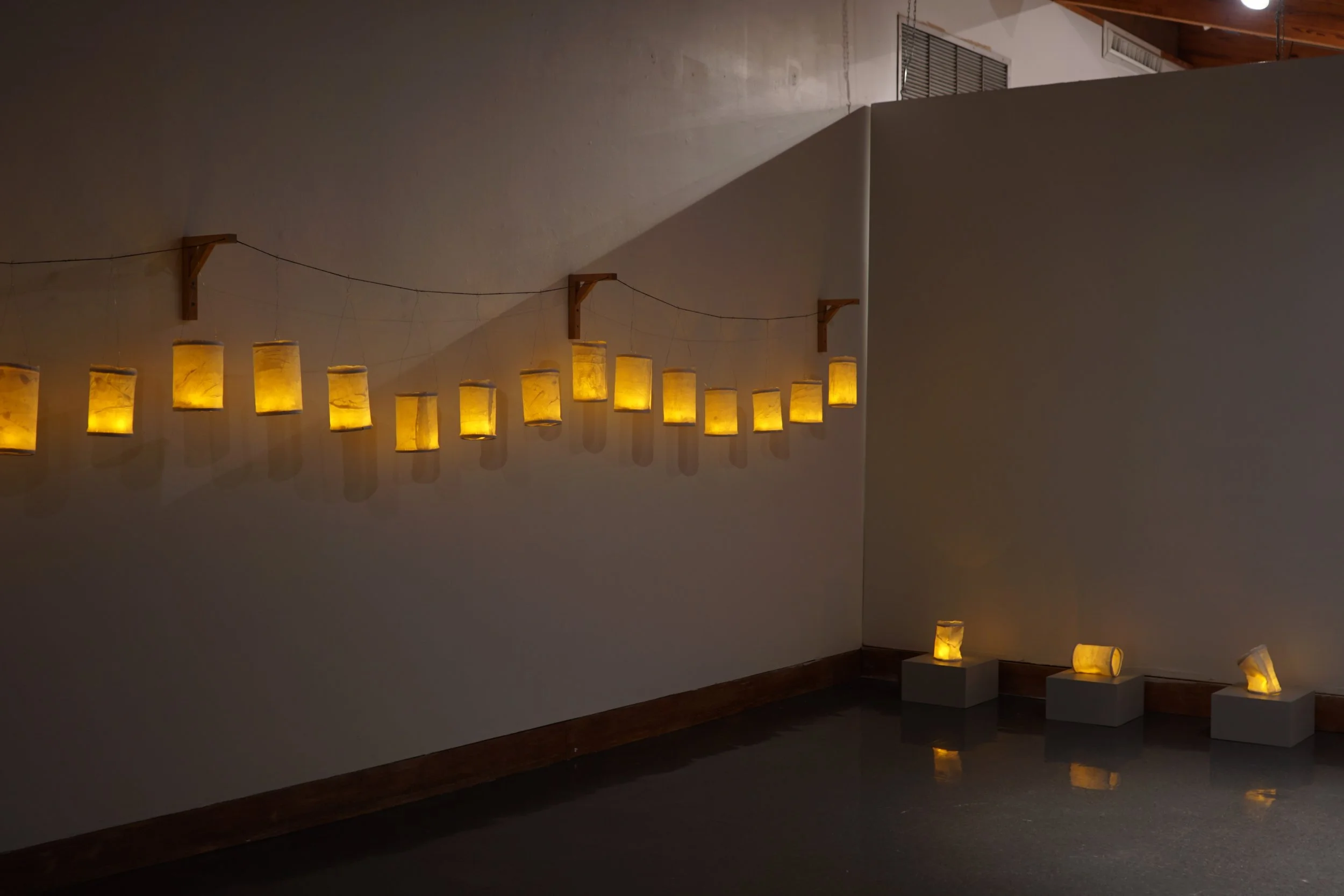 Longing  
porcelain, wire, wood, battery powered light 
Variables