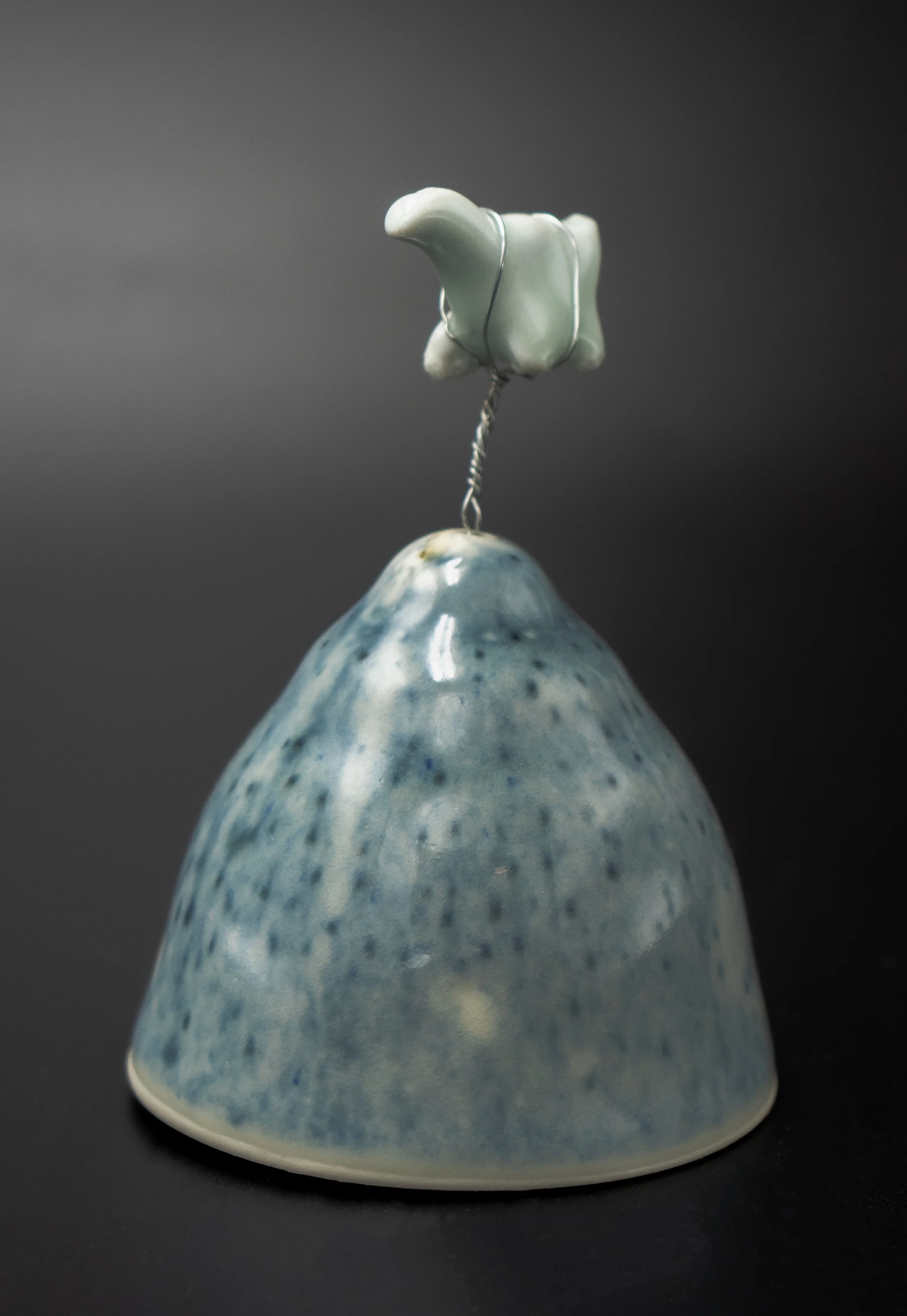 DISTANCE  
porcelain, glaze, wire 
9 × 4 ½ × 4 ½ inches