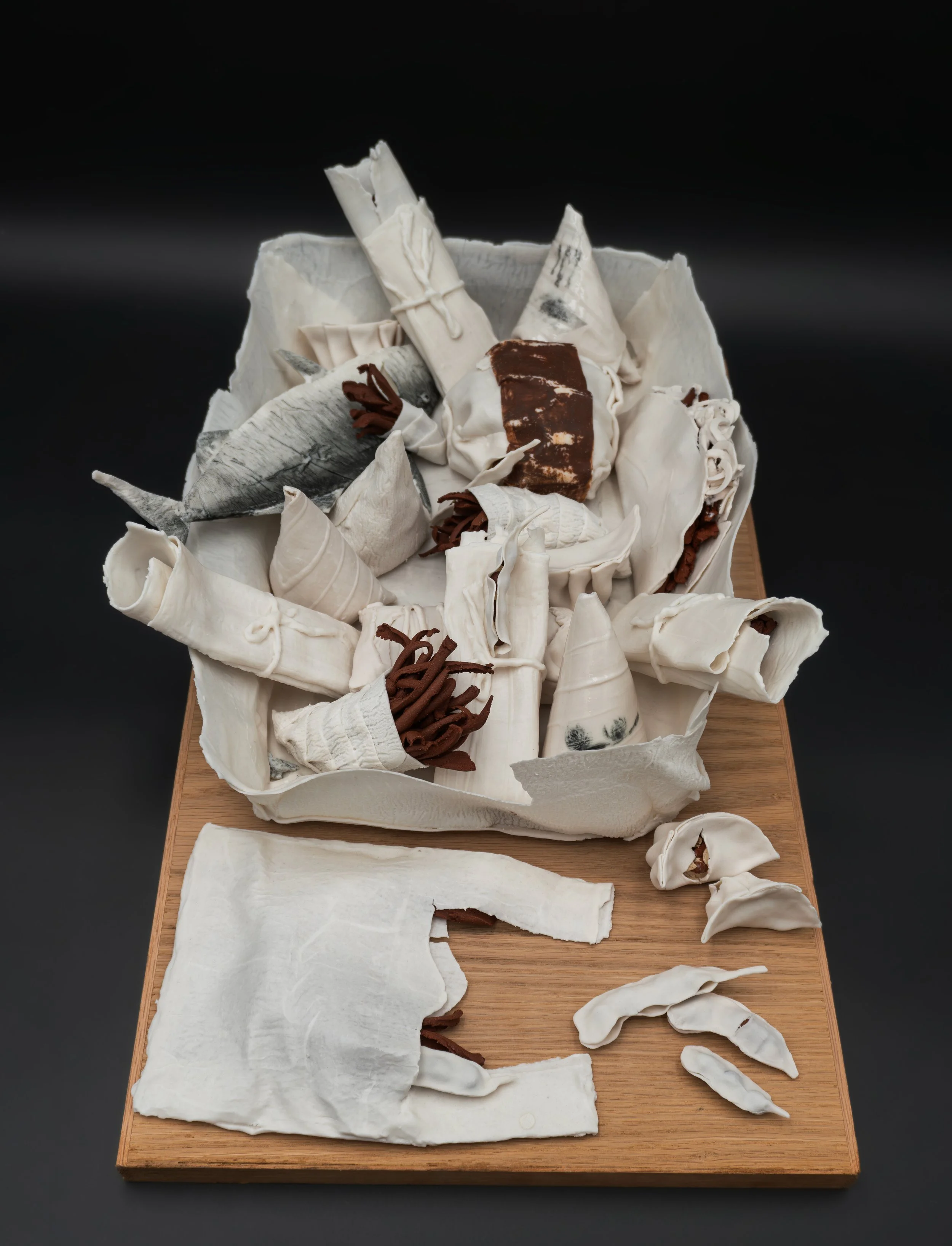 Untitled I  
porcelain, stoneware, underglaze 
6 × 10 ½ × 23 ¼ inches