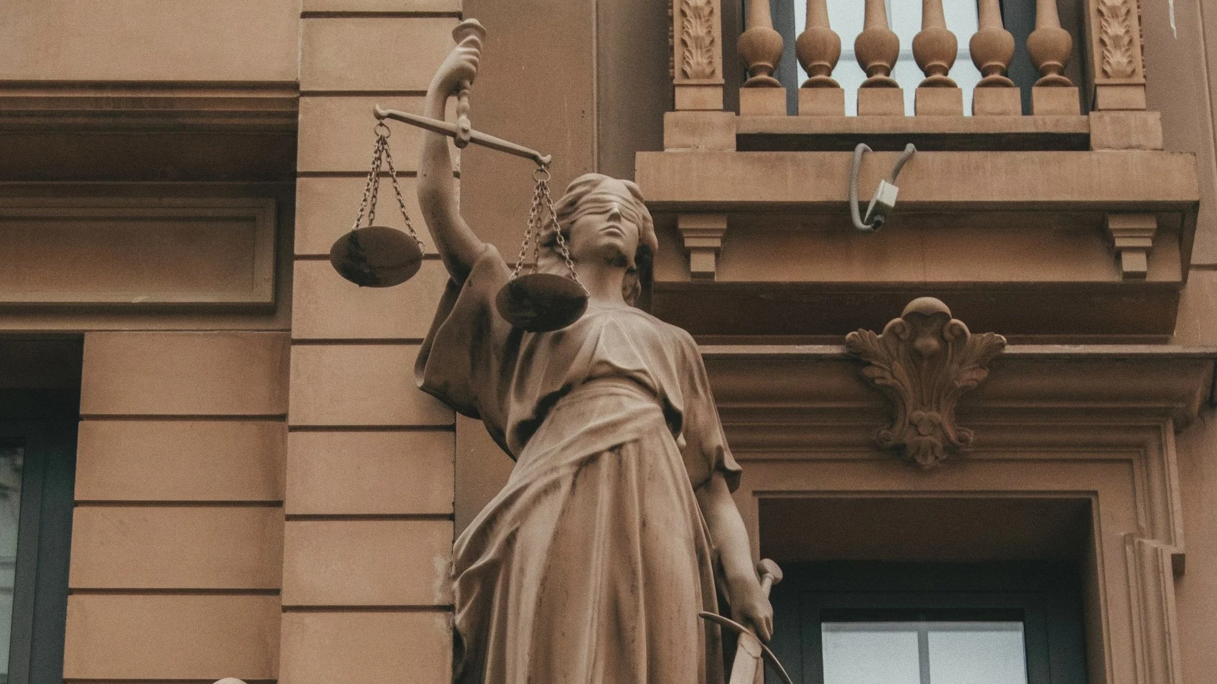 Statue of Justice holding scales