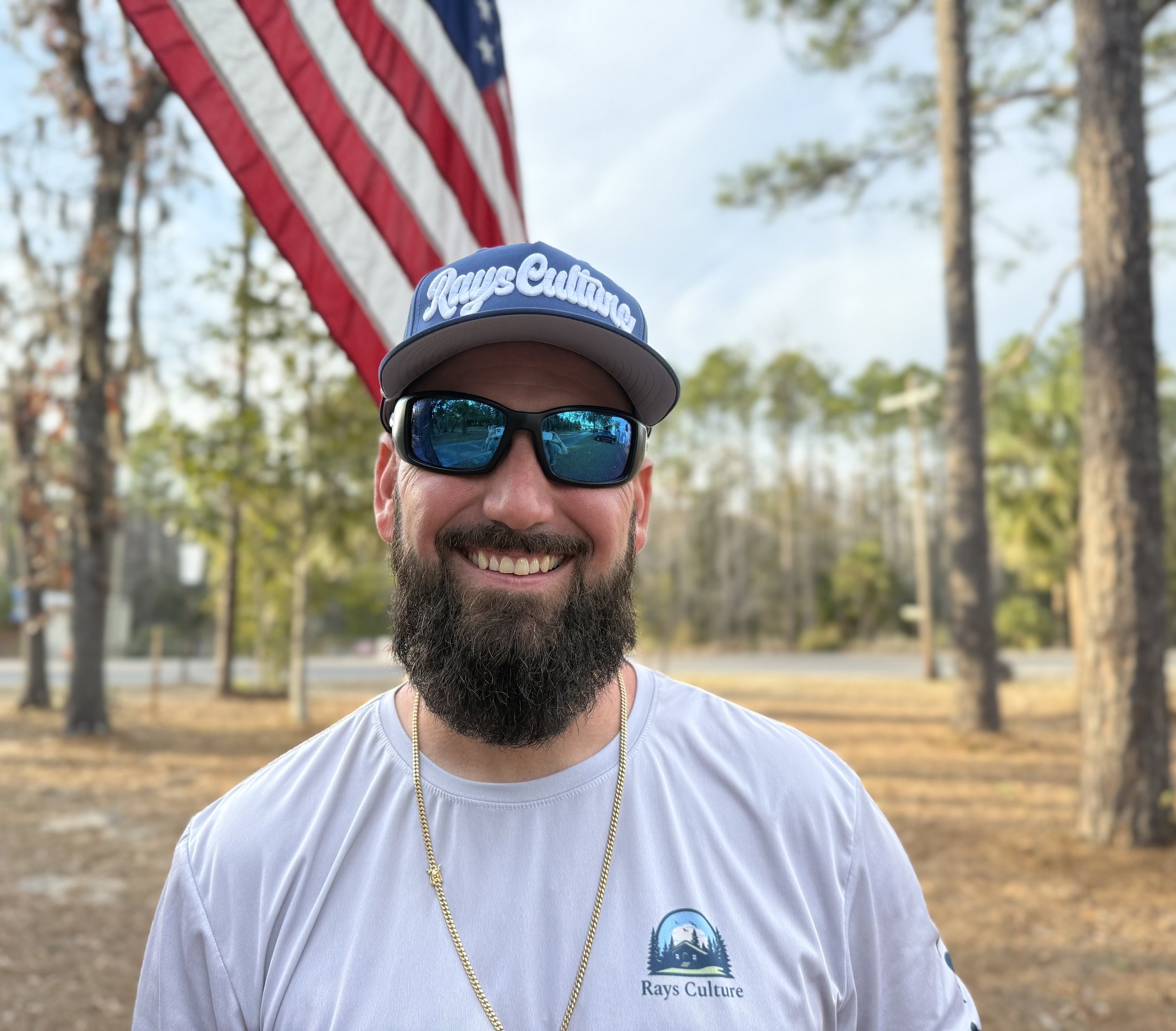 An image of a blue rope cap with an image of a fish that says 'Rays Culture'