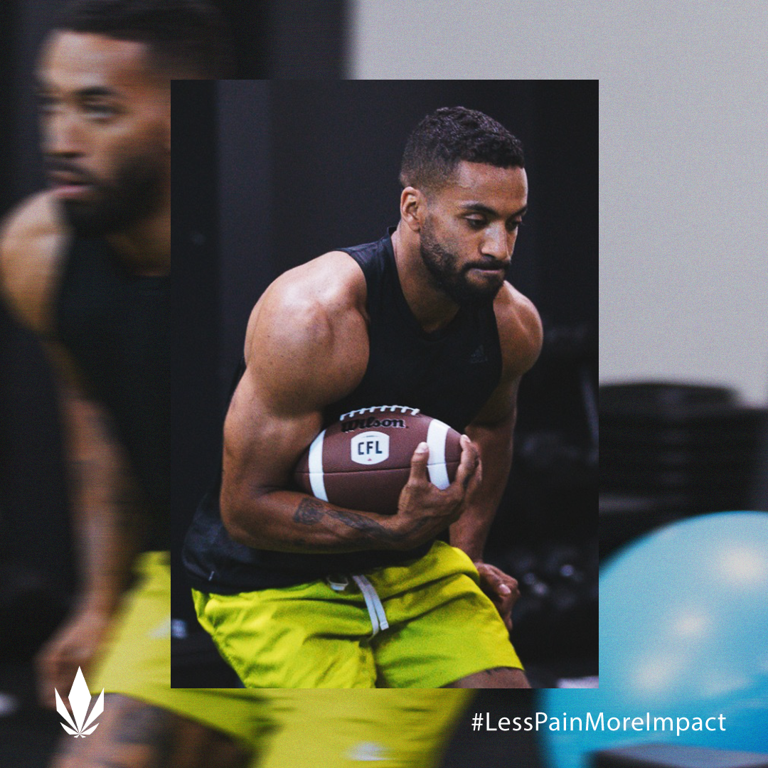 Man wearing black tank top and yellow shorts holding a CFL football in a gym setting. Hashtag #LessPainMoreImpact in corner.