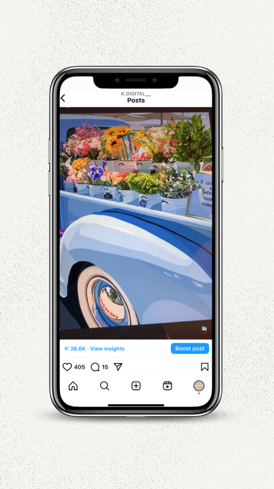 Vintage blue car with vibrant flowers in the trunk, displayed on a smartphone screen.