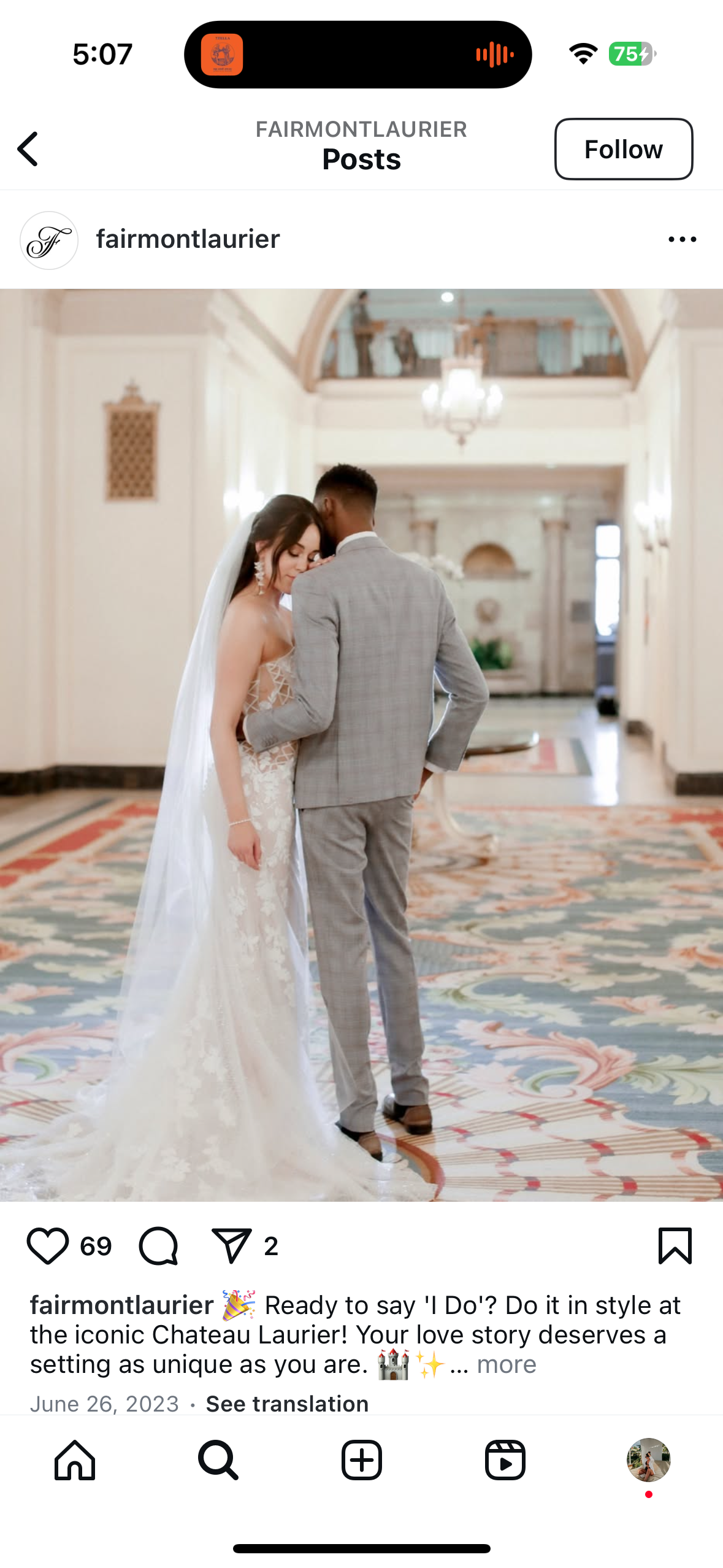 Bride and groom embracing in an elegant hallway at Chateau Laurier, with the bride wearing a lace gown and veil.