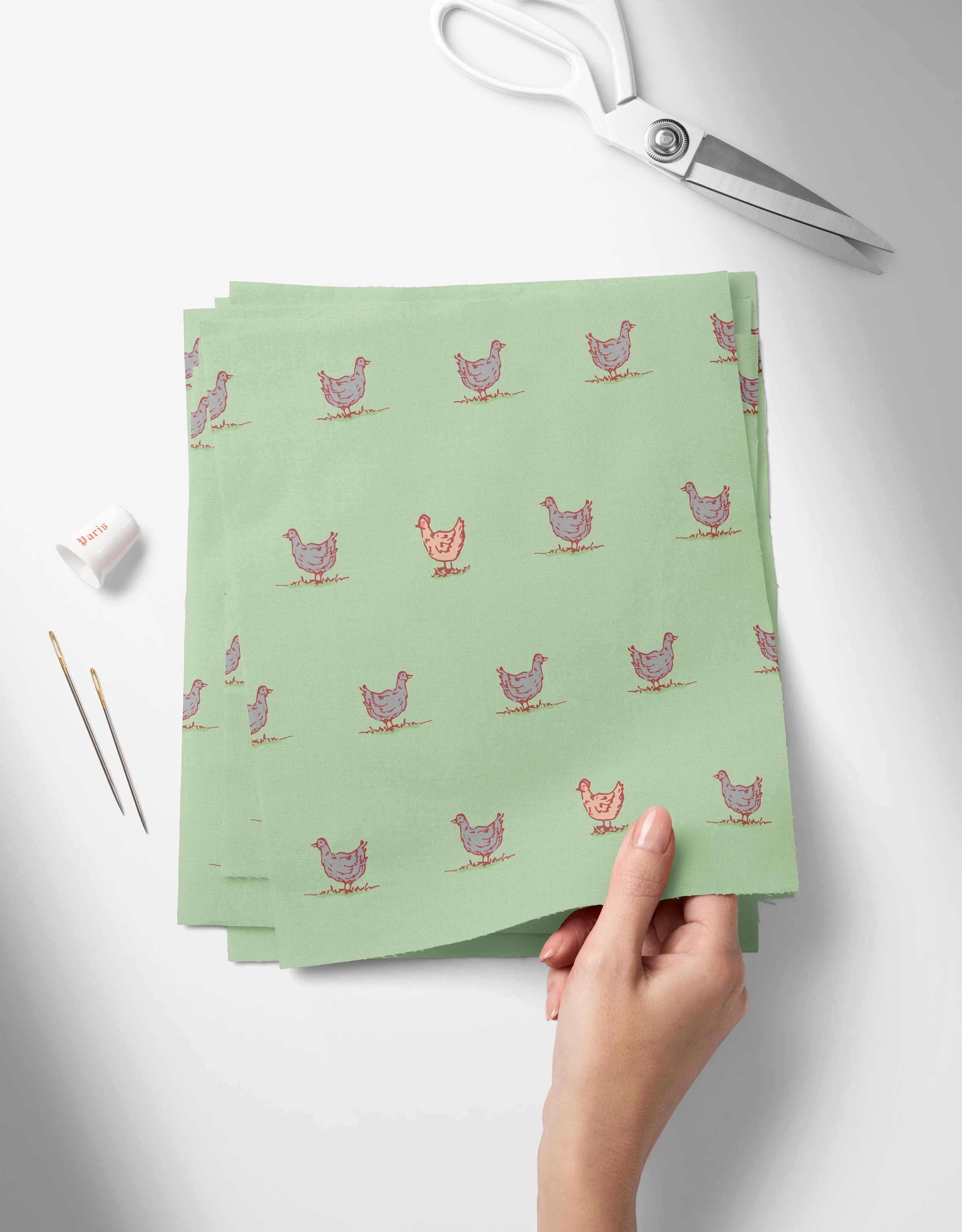 Chickens - Green-01_Top View of Fabric Swatches Held in Hand Mockup by Creatsy®.jpg