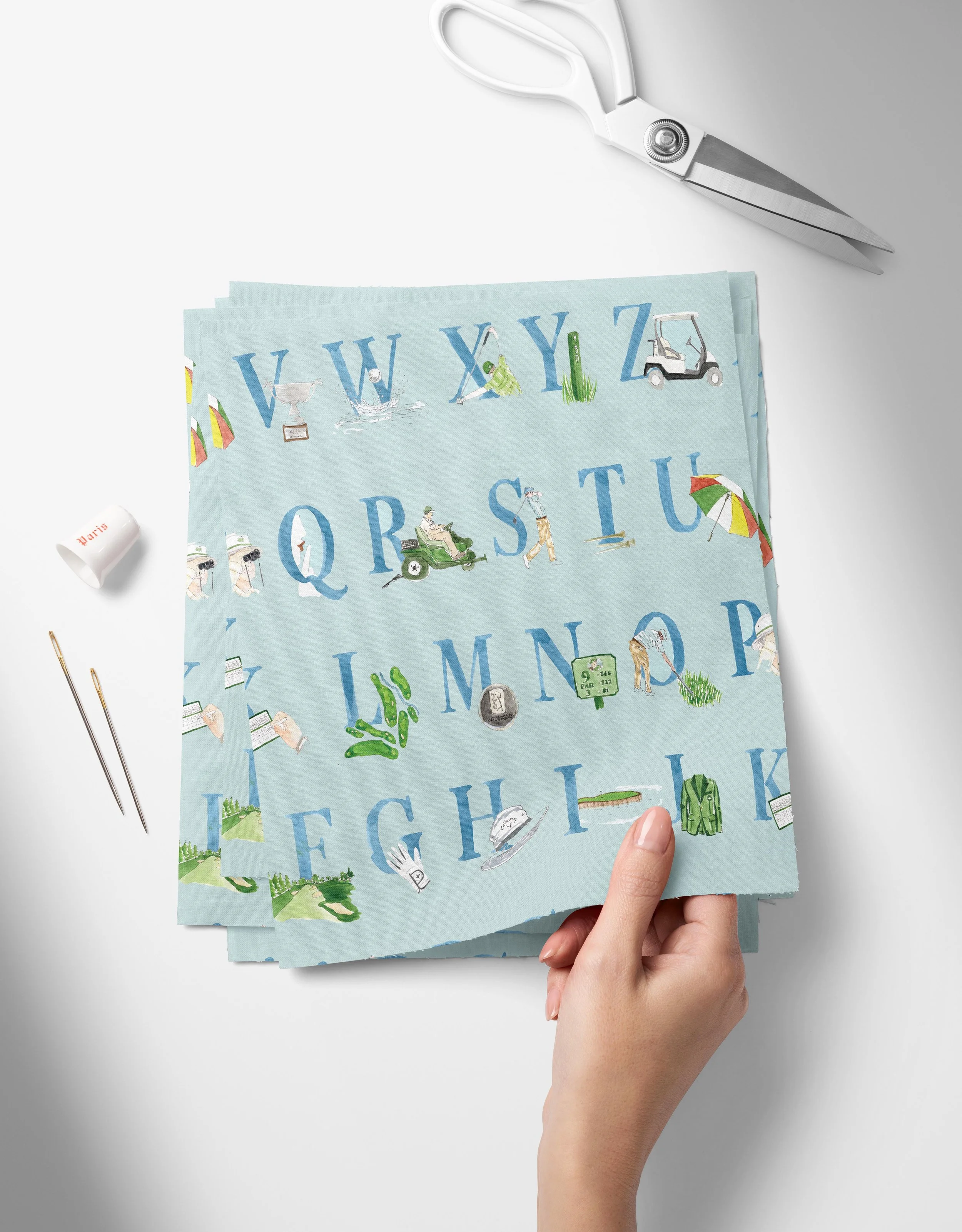ABCs of Golf Layout-blue-01_Top View of Fabric Swatches Held in Hand Mockup by Creatsy®.jpg