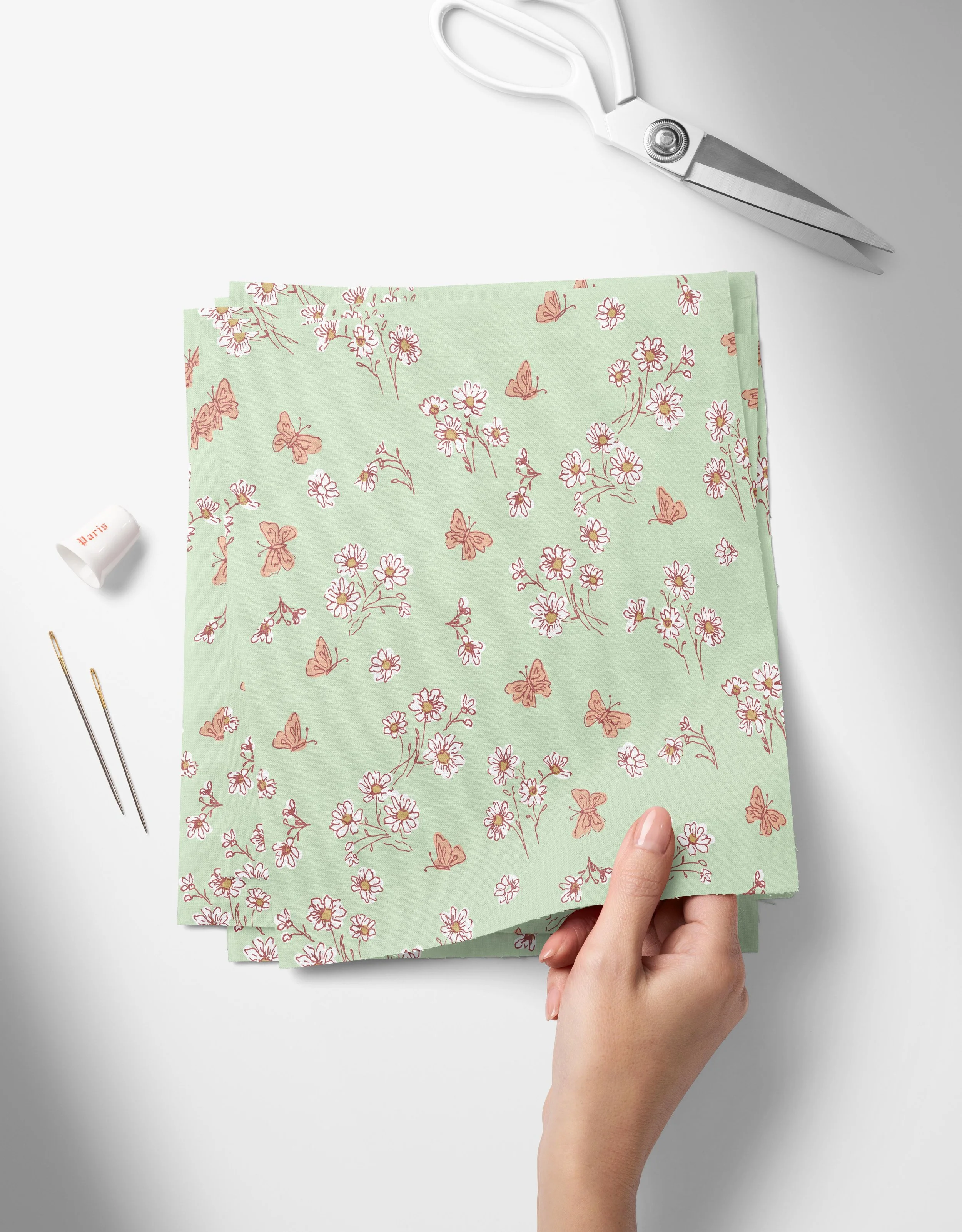 Daisies- Green-01_Top View of Fabric Swatches Held in Hand Mockup by Creatsy®.jpg