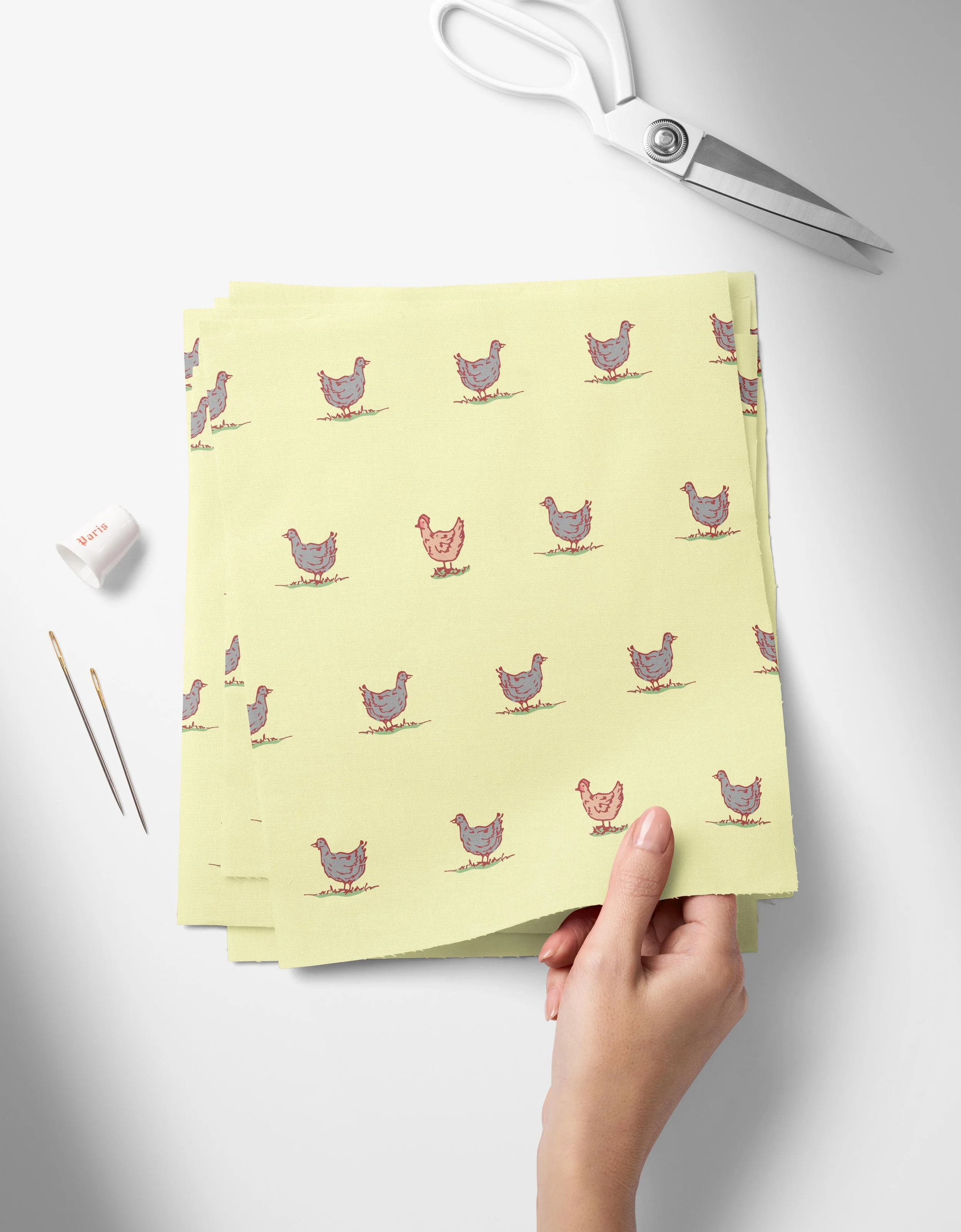 Chickens - Yellow-01_Top View of Fabric Swatches Held in Hand Mockup by Creatsy®.jpg