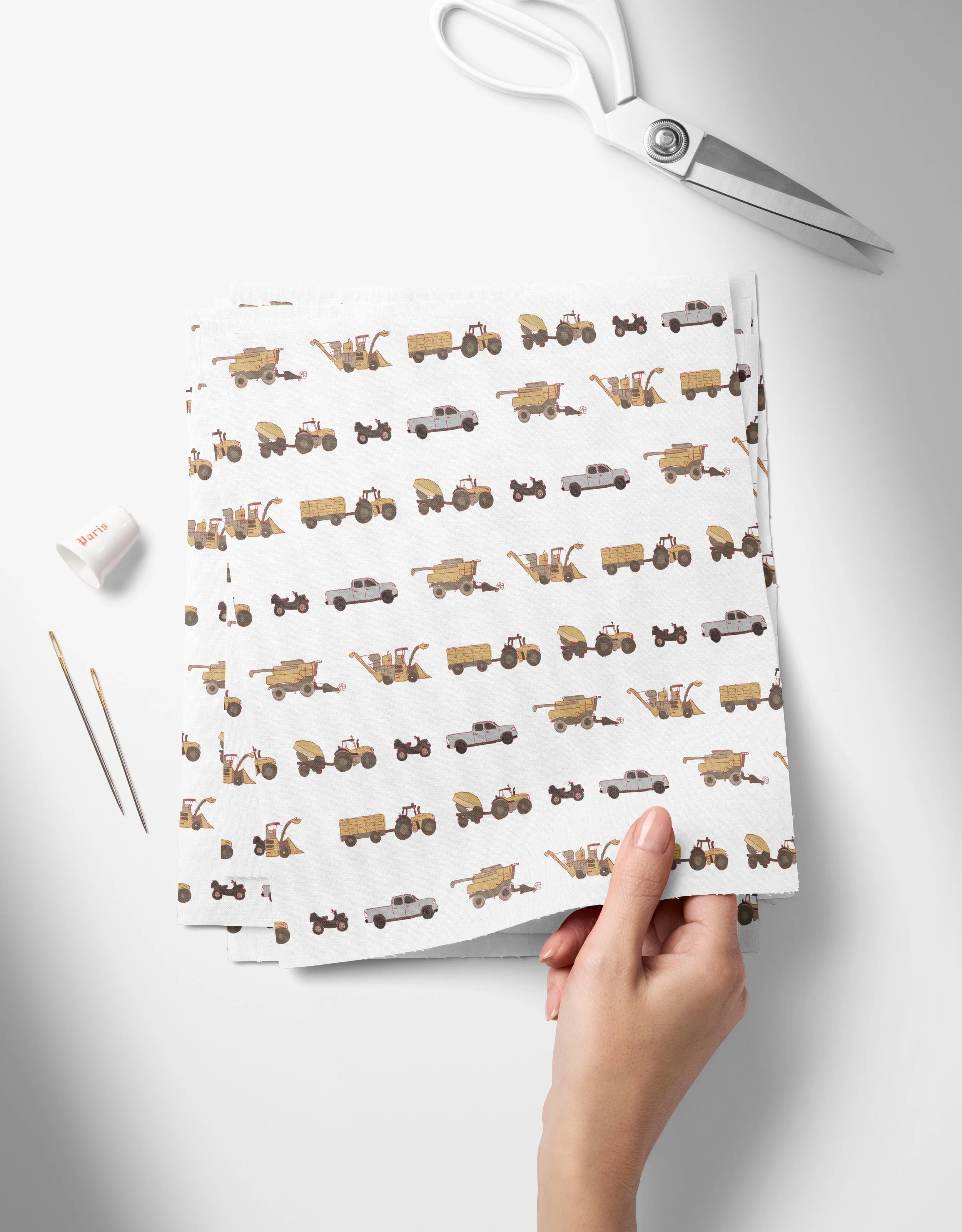Farm Vehicles-01-01_Top View of Fabric Swatches Held in Hand Mockup by Creatsy®.jpg