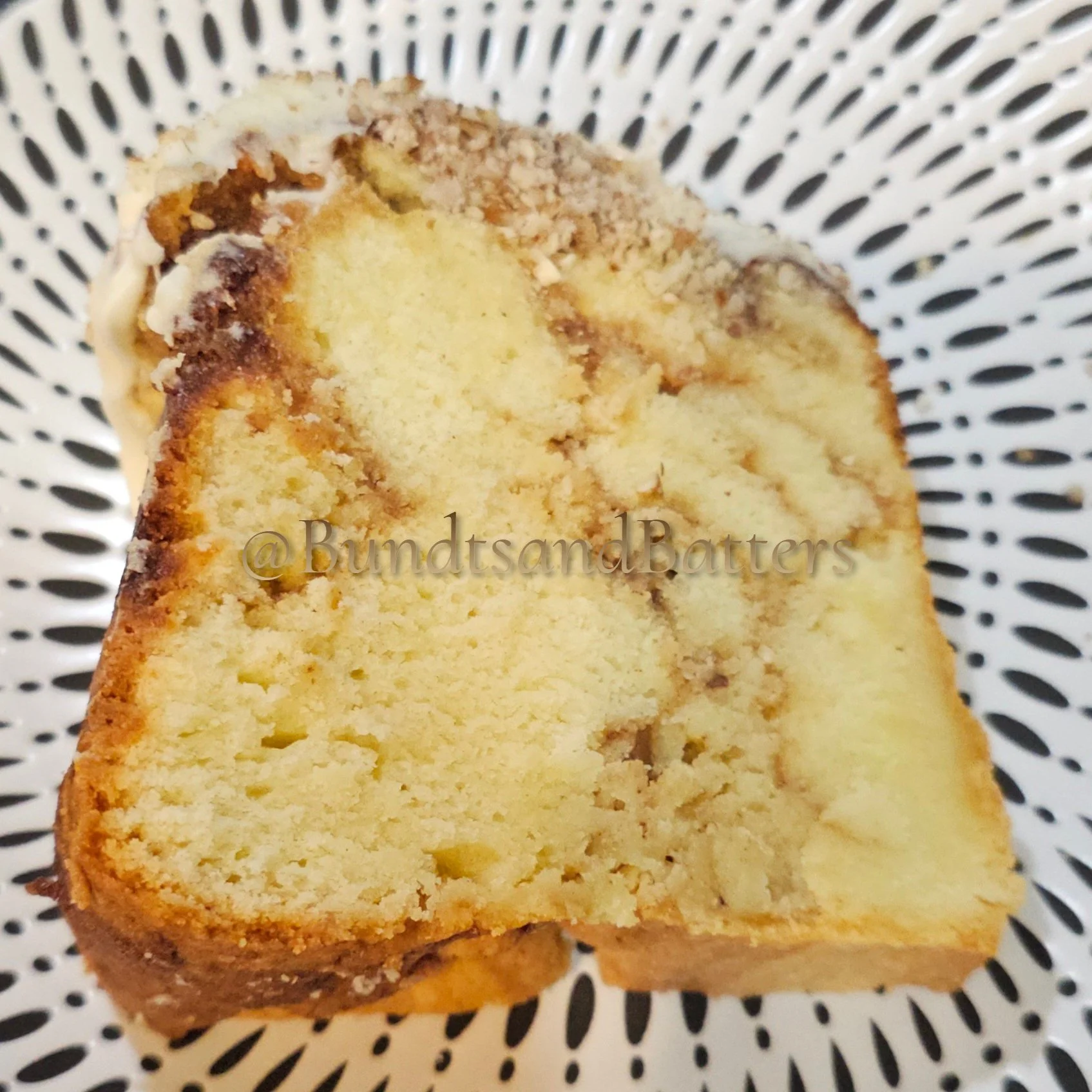 Cinnamon Roll Pound Cake with Cream Cheese Frosting and Chopped Pecans