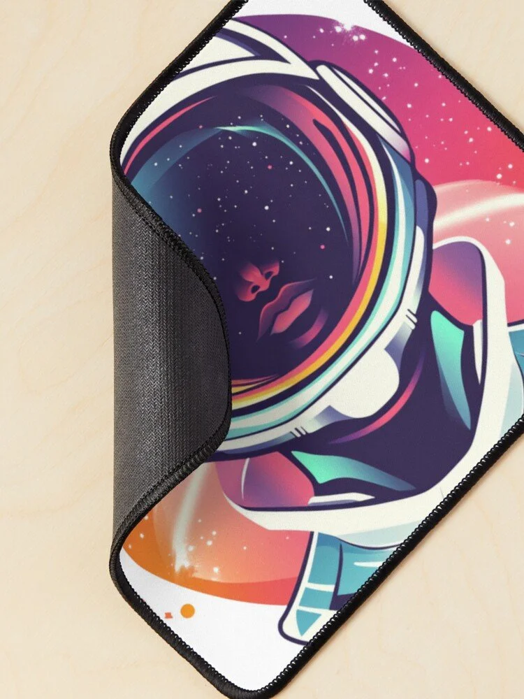 A mouse pad with a colorful astronaut helmet design featuring a woman's face and a galaxy pattern.