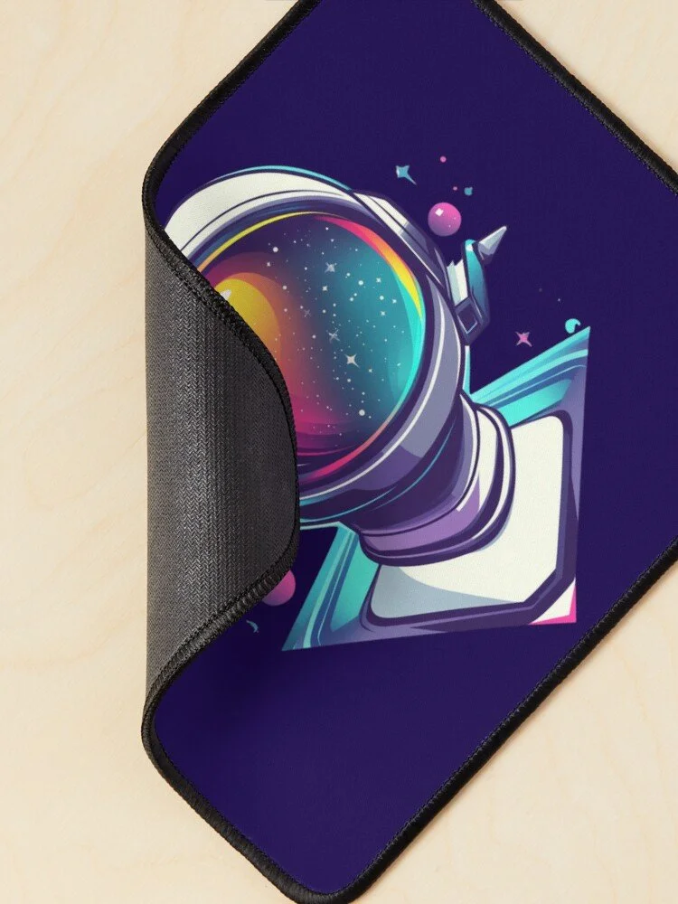 Close-up of a colorful astronaut helmet design on a mouse pad with space elements, partially turned up.