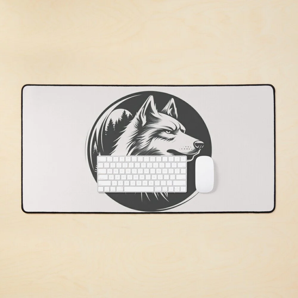 A computer mouse and keyboard on a white mouse pad with a black and white wolf illustration and tree silhouette in the background.